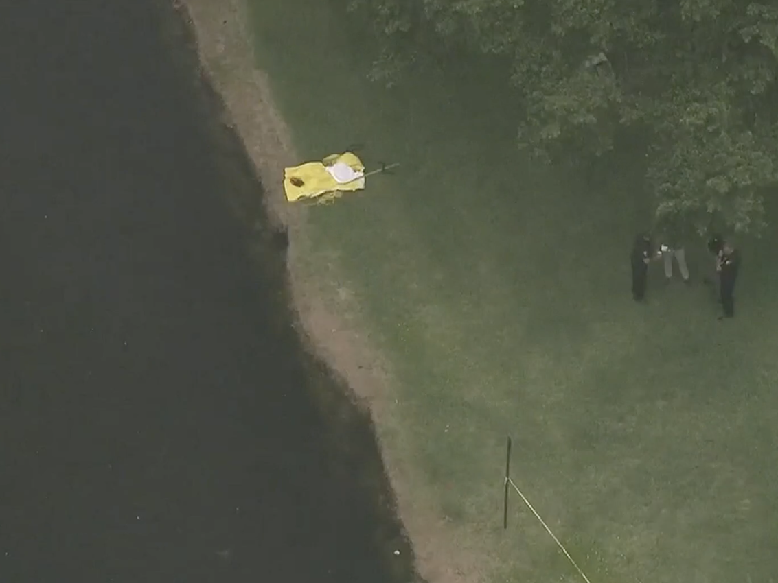 Police investigate scene of a Florida canal where two girls where found dead.