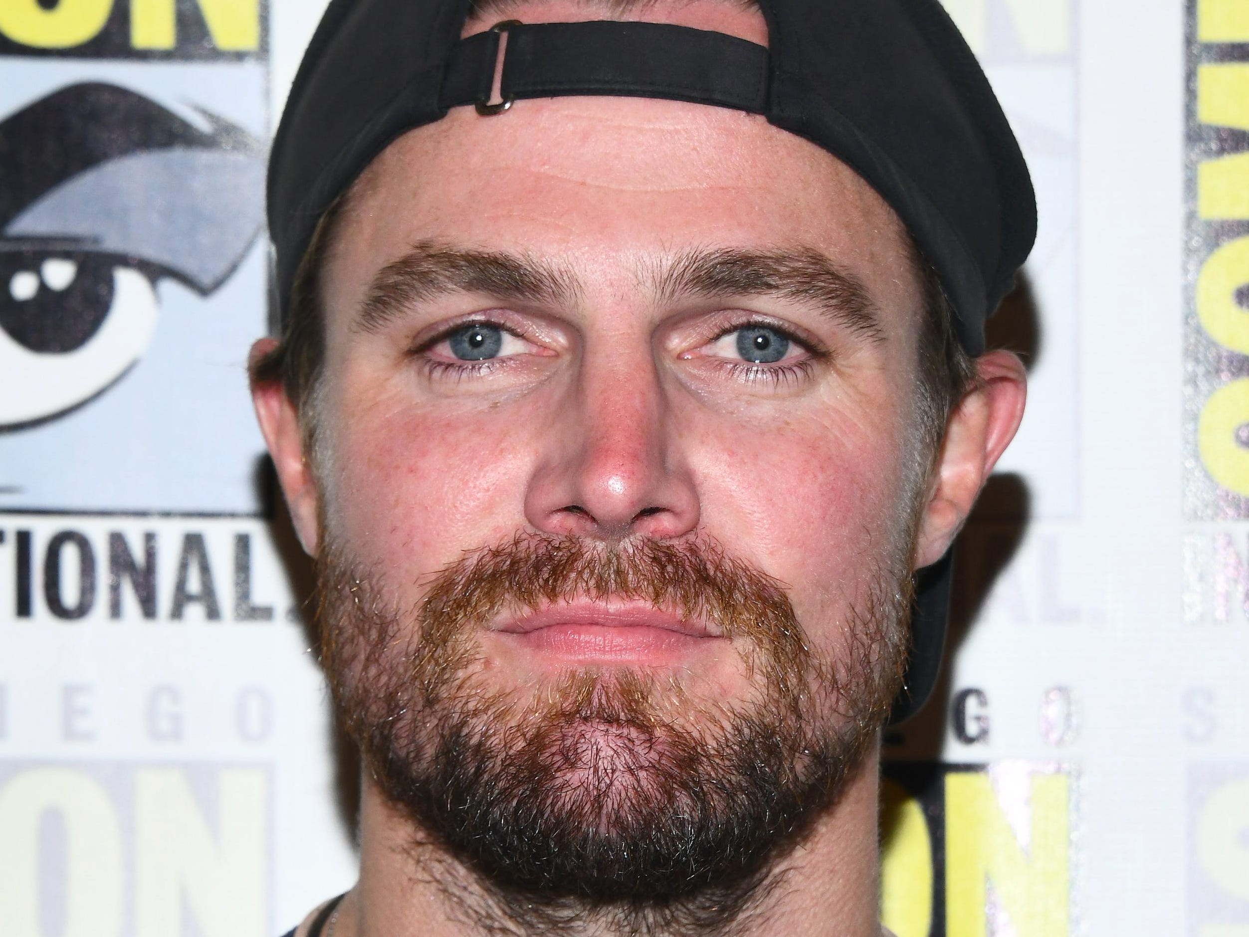 Stephen Amell poses for a photo at the 2019 San Diego Comic Con.