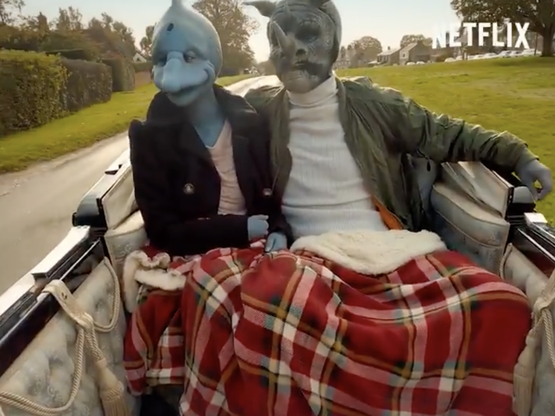 A woman dressed as a dolphin and a man dressed as a rhino share a romantic horse-drawn carriage ride as part of Netflix's upcoming dating reality show "Sexy Beasts."