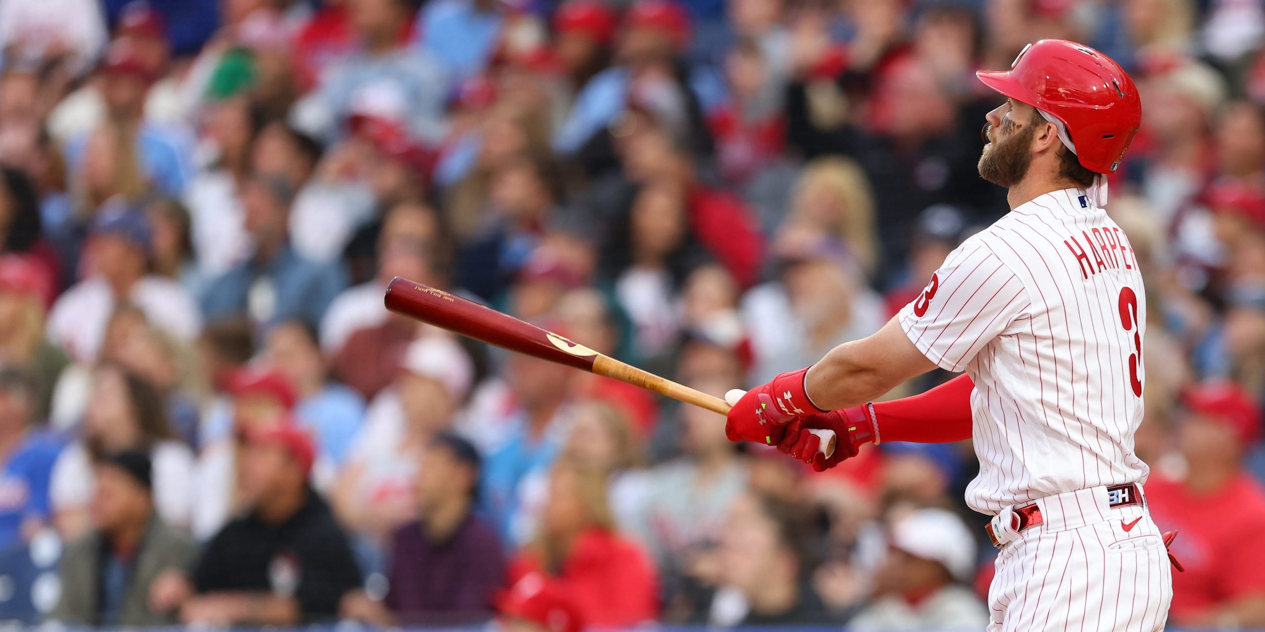 : Bryce Harper #3 of the Philadelphia Phillies watches as he hits a home run against the Washington Nationals during the second inning of a game at Citizens Bank Park on June 22, 2021 in Philadelphia, Pennsylvania.