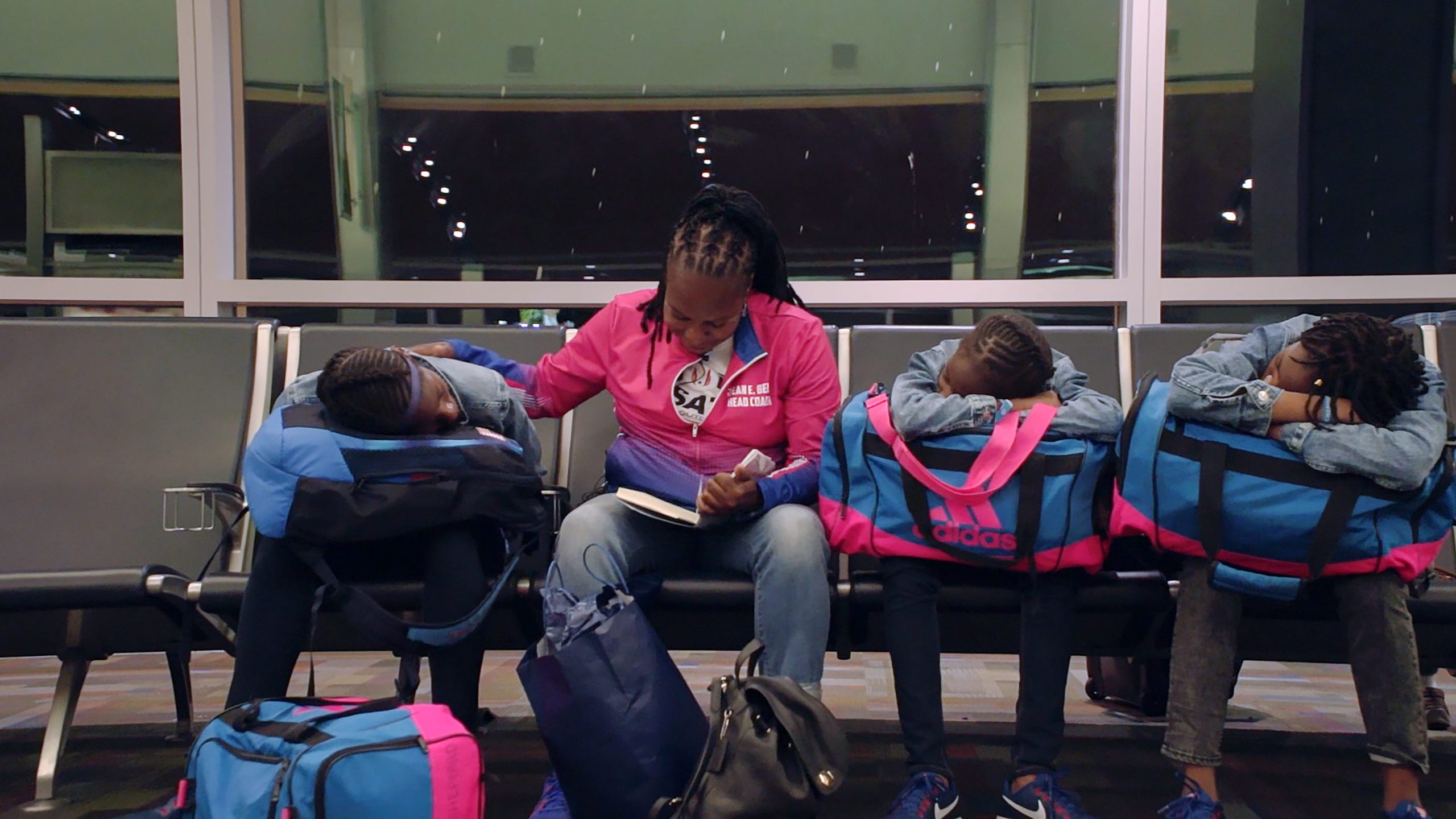 Jean Bell and the Sheppard sisters in an airport.