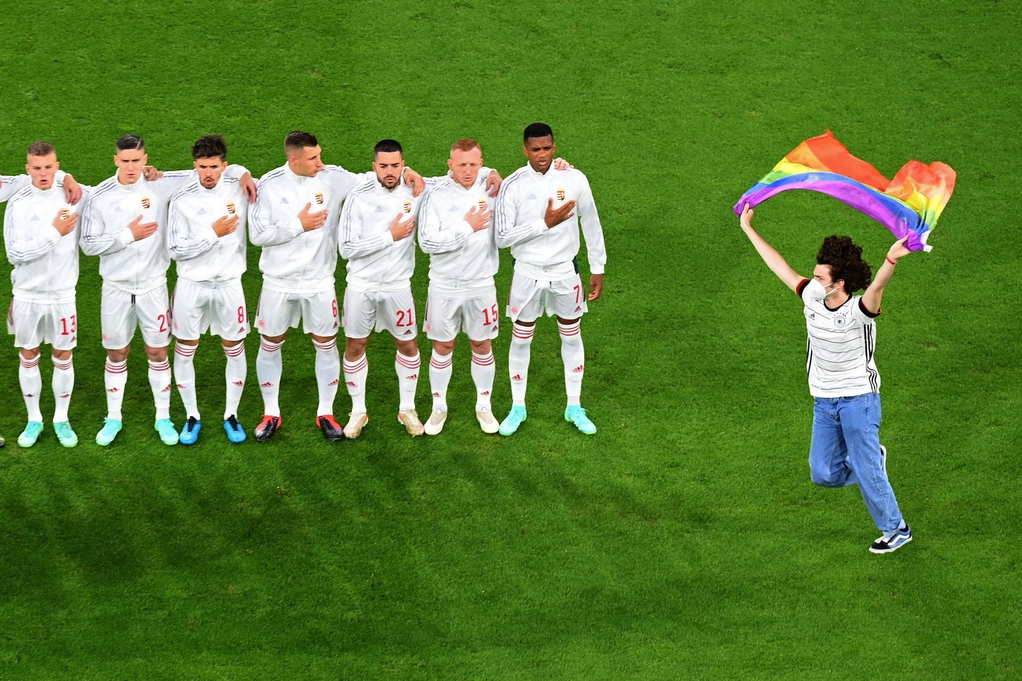 A streaker runs onto the pitch during Hungary’s national anthem