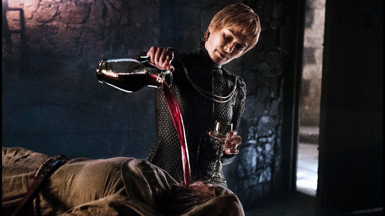 Cersei pouring wine into the mouth of Septa Unella