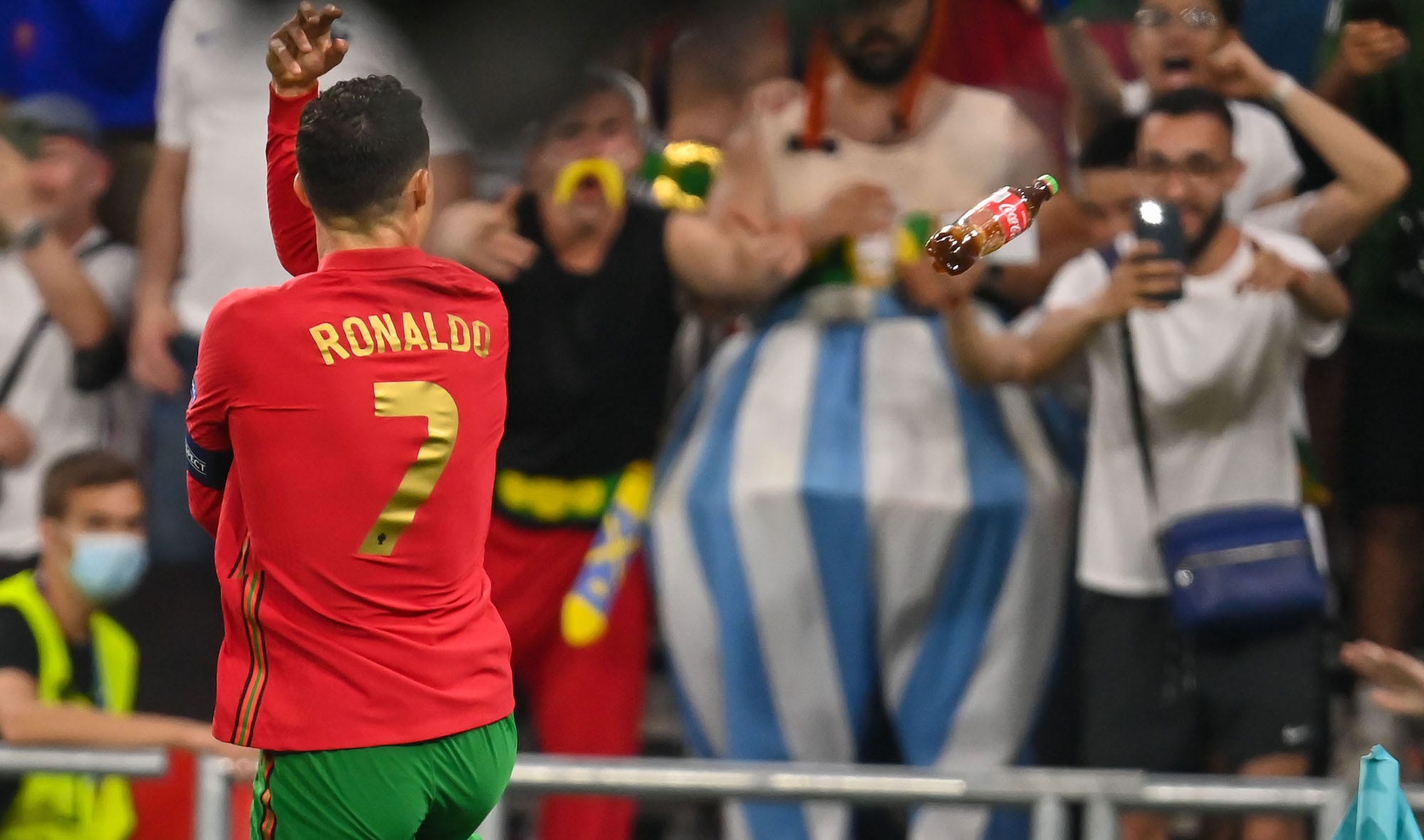 Ronaldo has a bottle of Coke thrown at him during a Euro 2020 match between Portugal and France