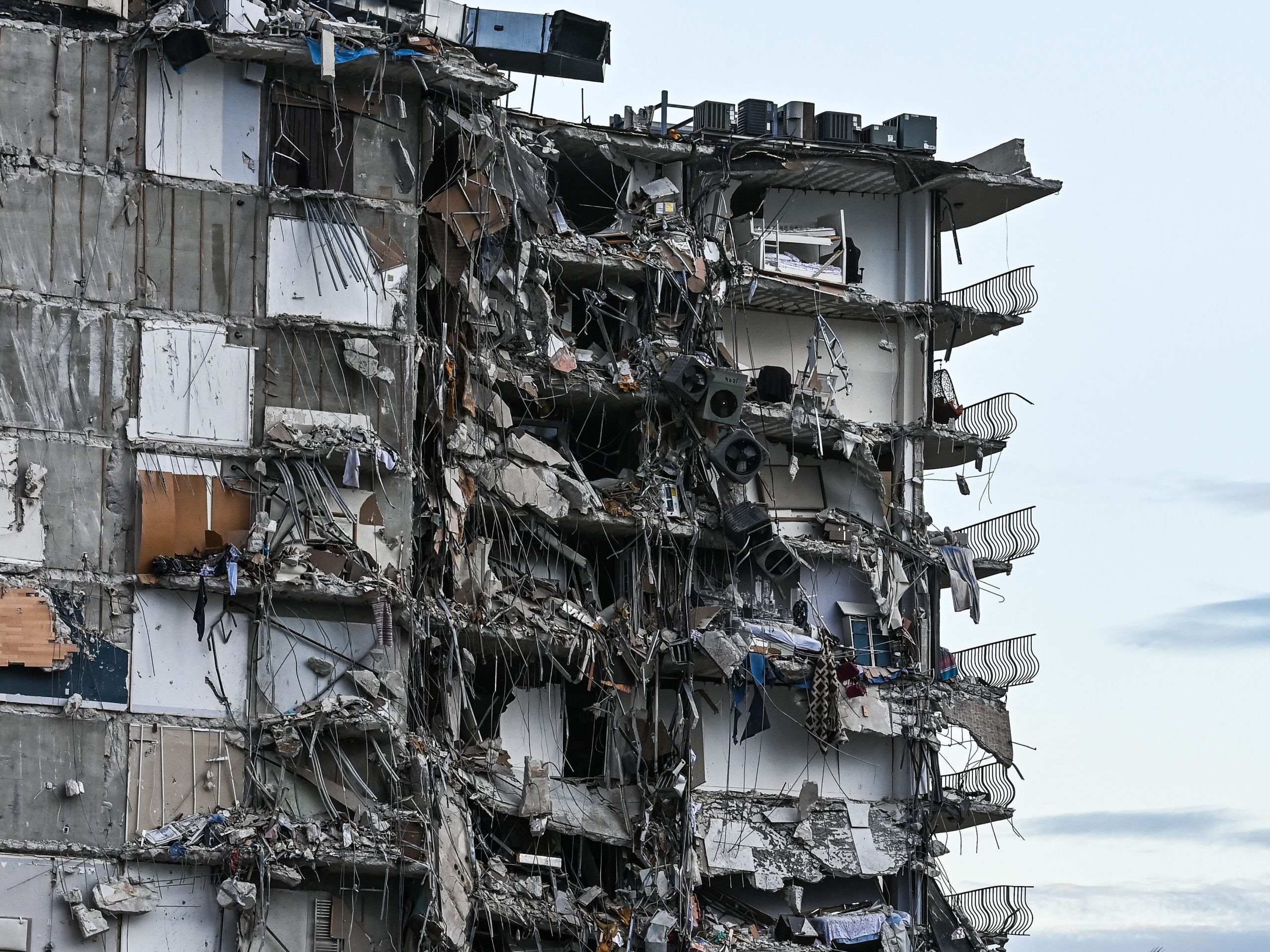 Rubble hangs from a partially collapsed building in Surfside, north of Miami Beach.