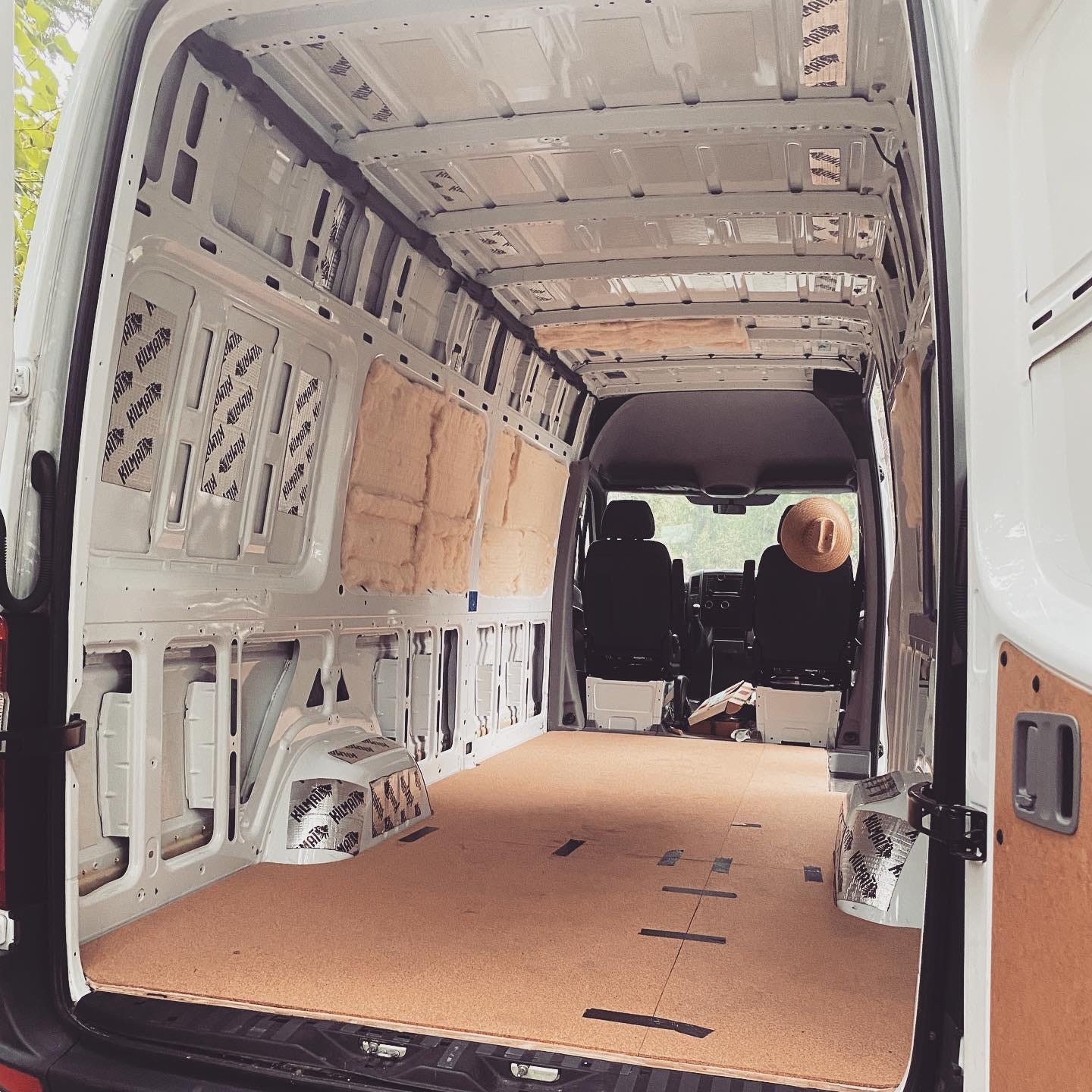 The empty inside of a white van.