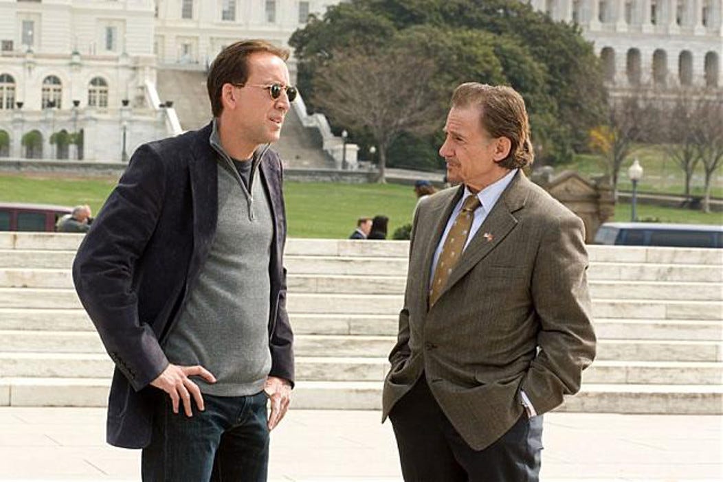 Nicolas Cage stanging next to Harvey Keitel