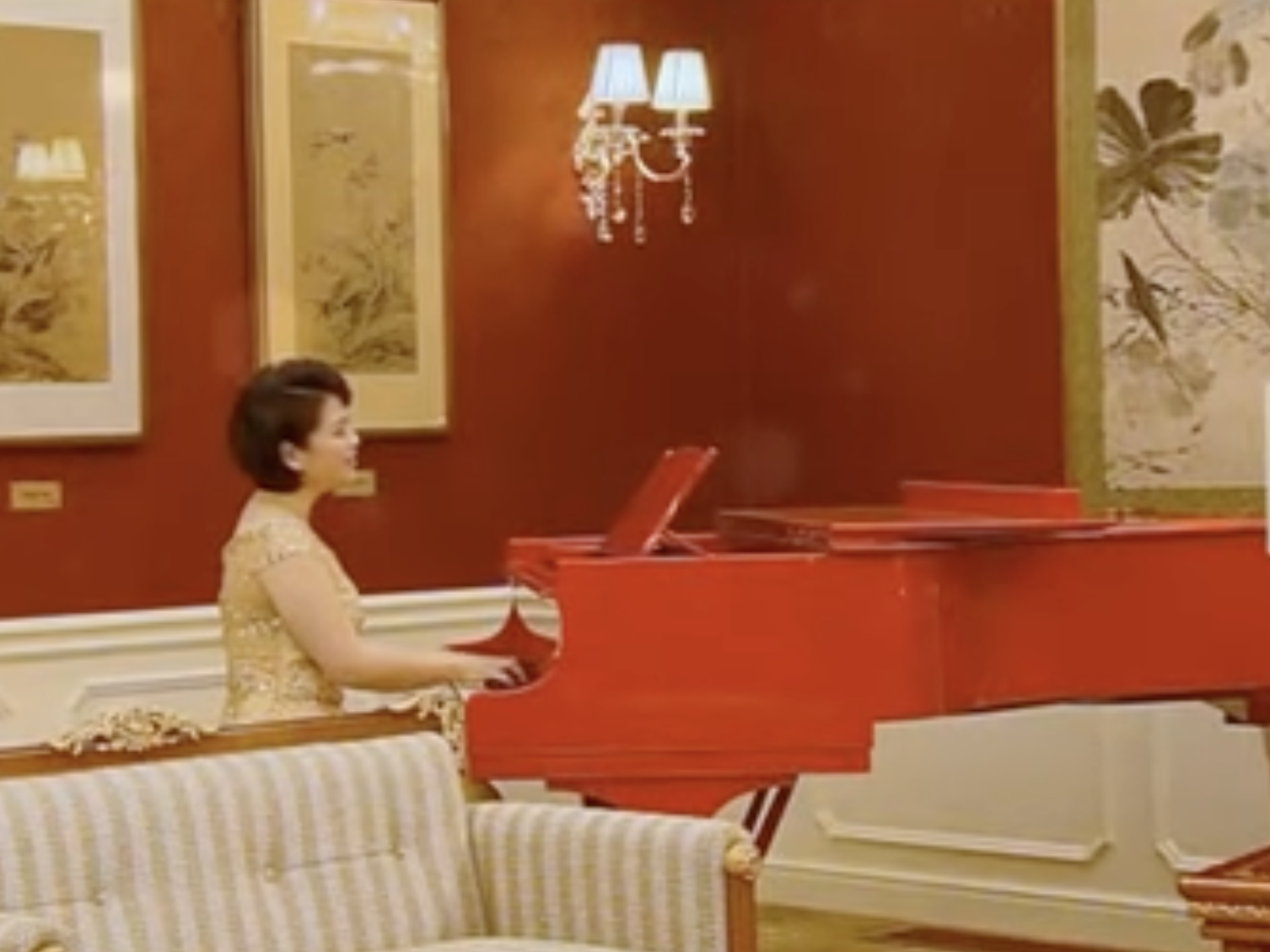 north korean singer at red grand piano