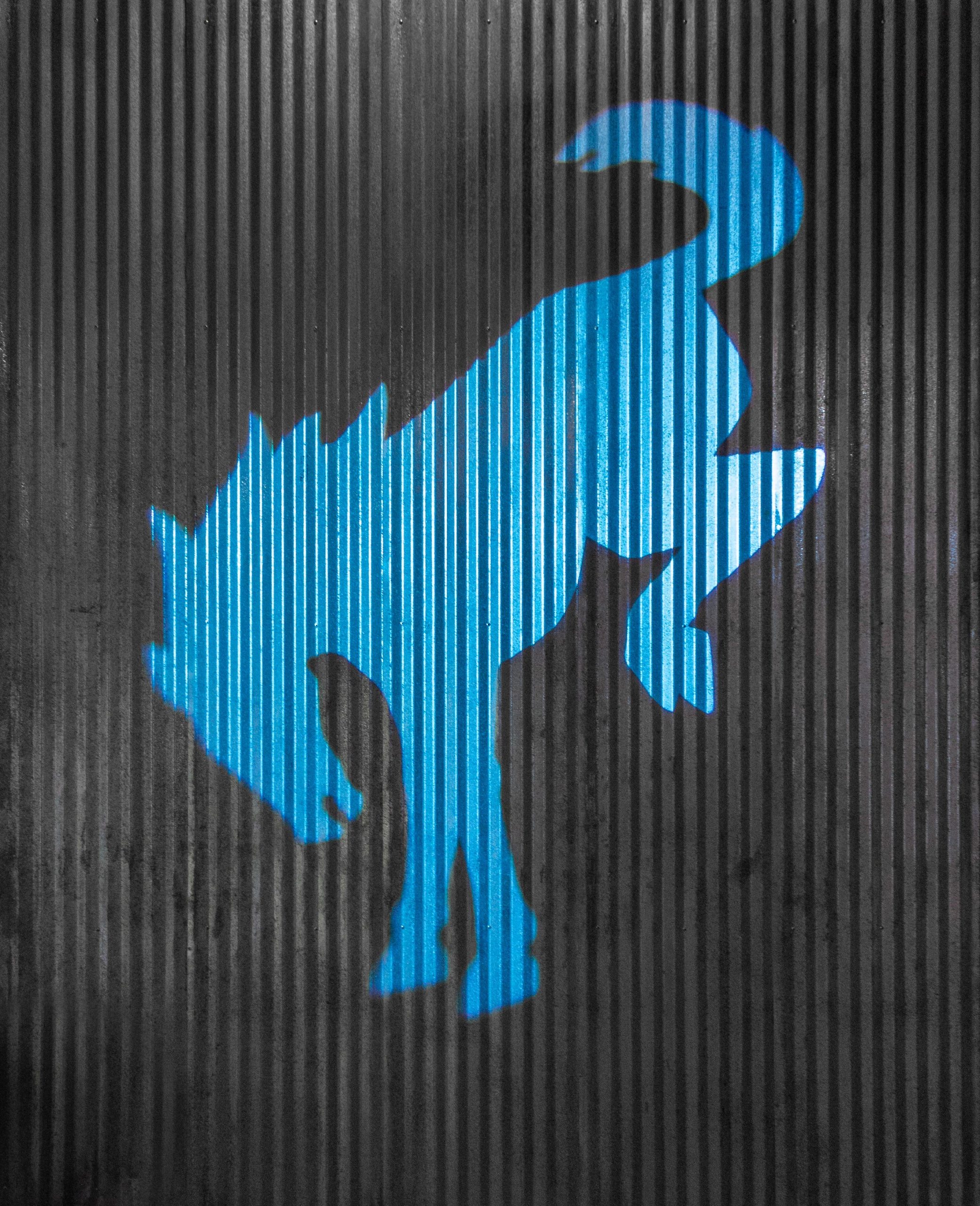 A Ford Bronco logo on a wall.