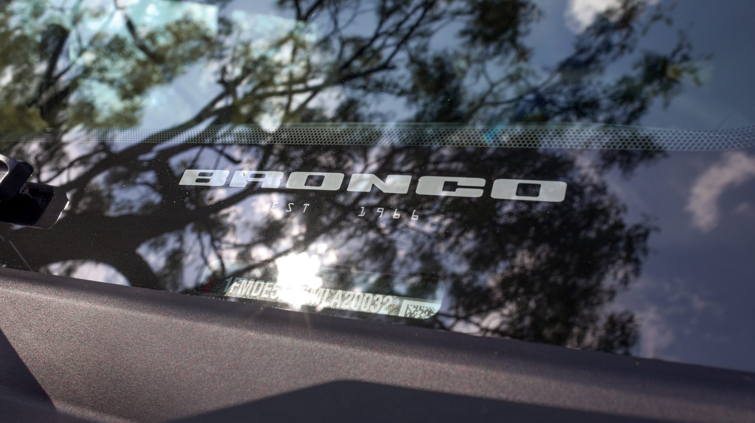 A "Bronco, established 1966" decal on the Bronco's windshield.