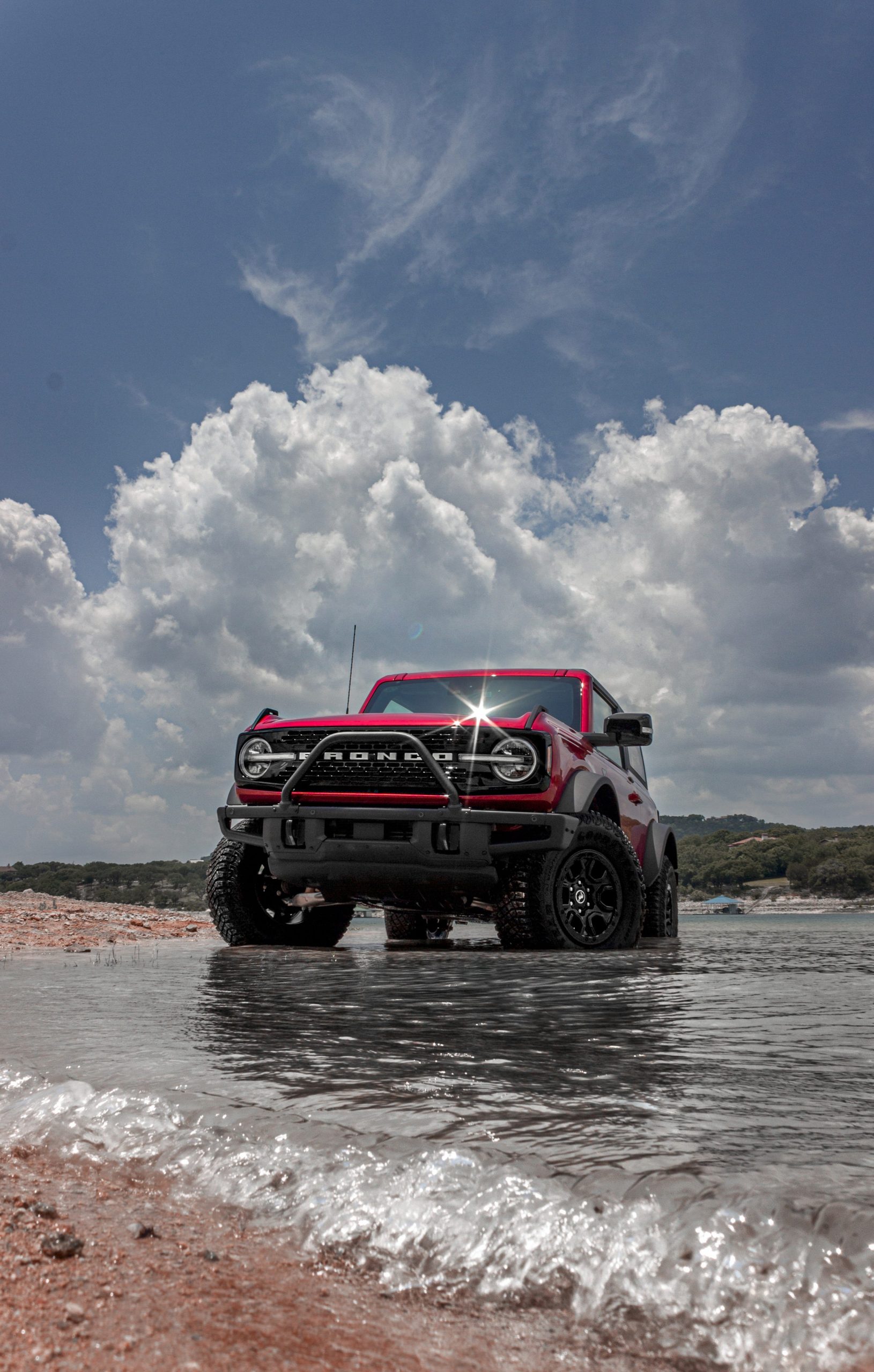 The Ford Bronco in a lake.