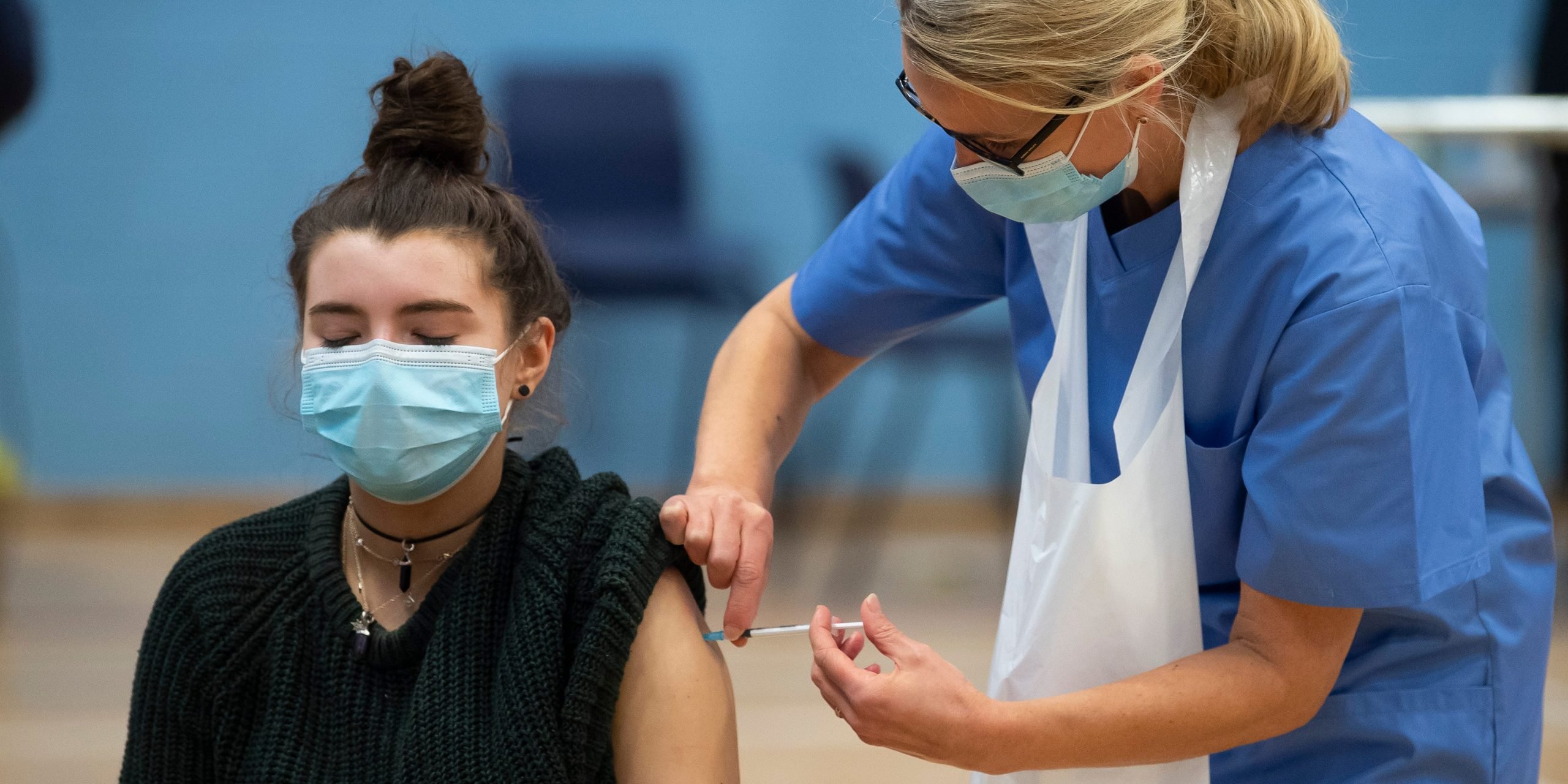 woman receiving covid vaccine