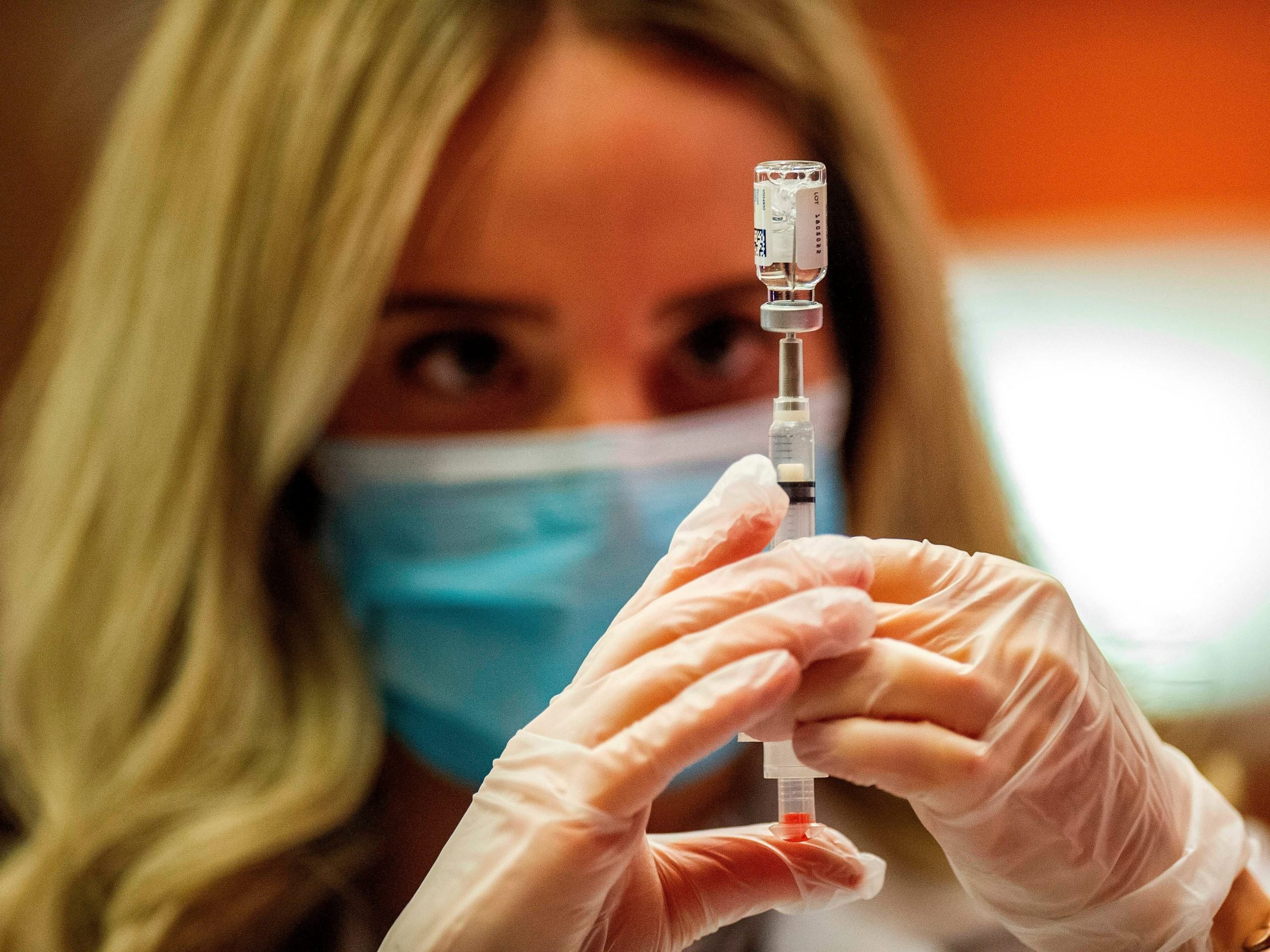 Pharmacist Madeline Acquilano fills a syringe with the Johnson & Johnson Covid-19 Vaccine before inoculating members of the public at Hartford Hospital in Hartford, Connecticut, on March 3, 2021. - Some 7,400 vials of the Johnson & Johnson Covid-19 single shot vaccine were delivered and an initial offering of the vaccine was given to ten members of the public. (Photo by Joseph Prezioso / AFP) (Photo by JOSEPH PREZIOSO/AFP via Getty Images)