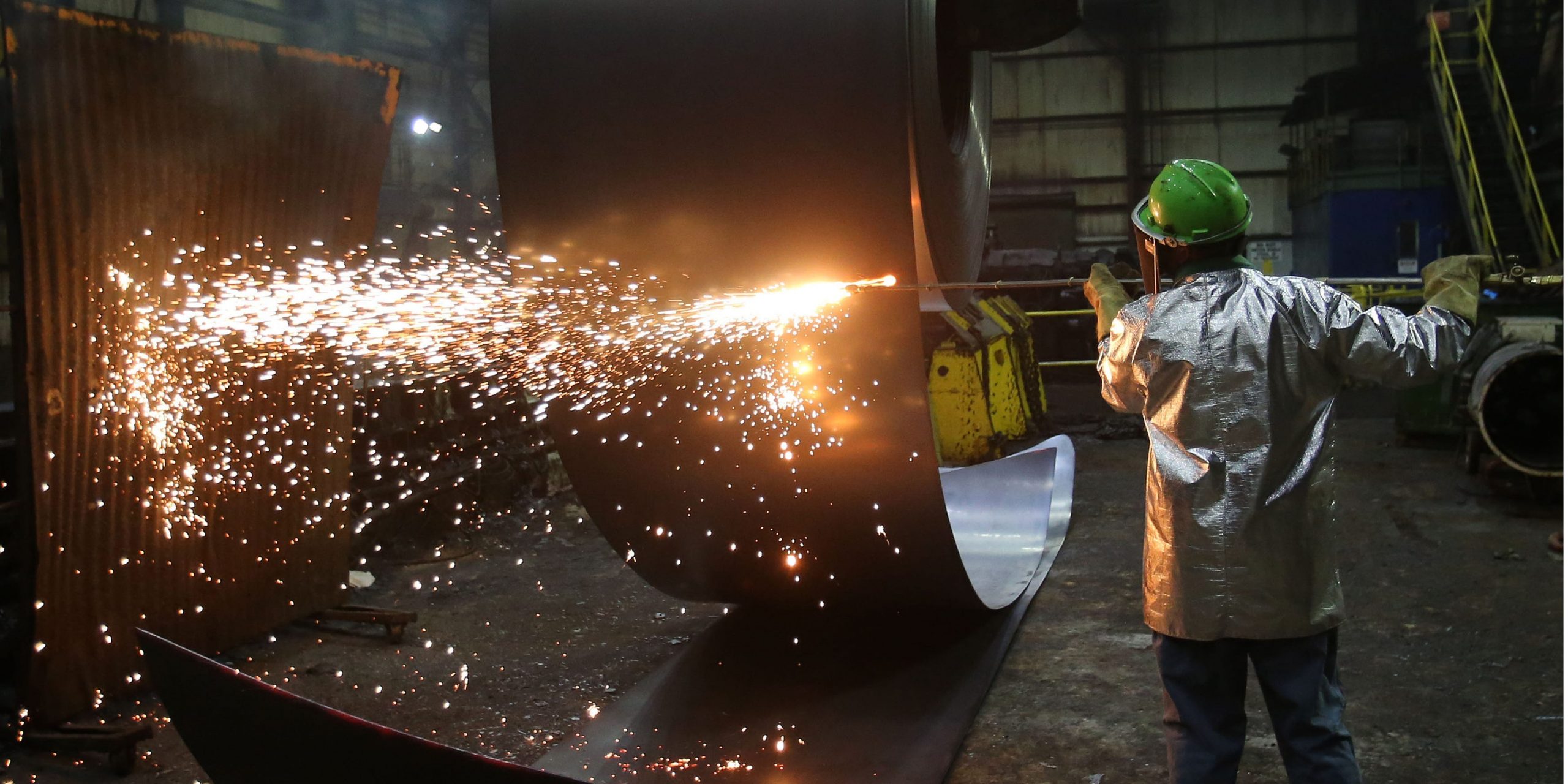 FILE PHOTO: A worker cuts a steel coil at the Novolipetsk Steel PAO steel mill in Farrell, Pennsylvania, U.S., March 9, 2018. REUTERS/Aaron Josefczyk