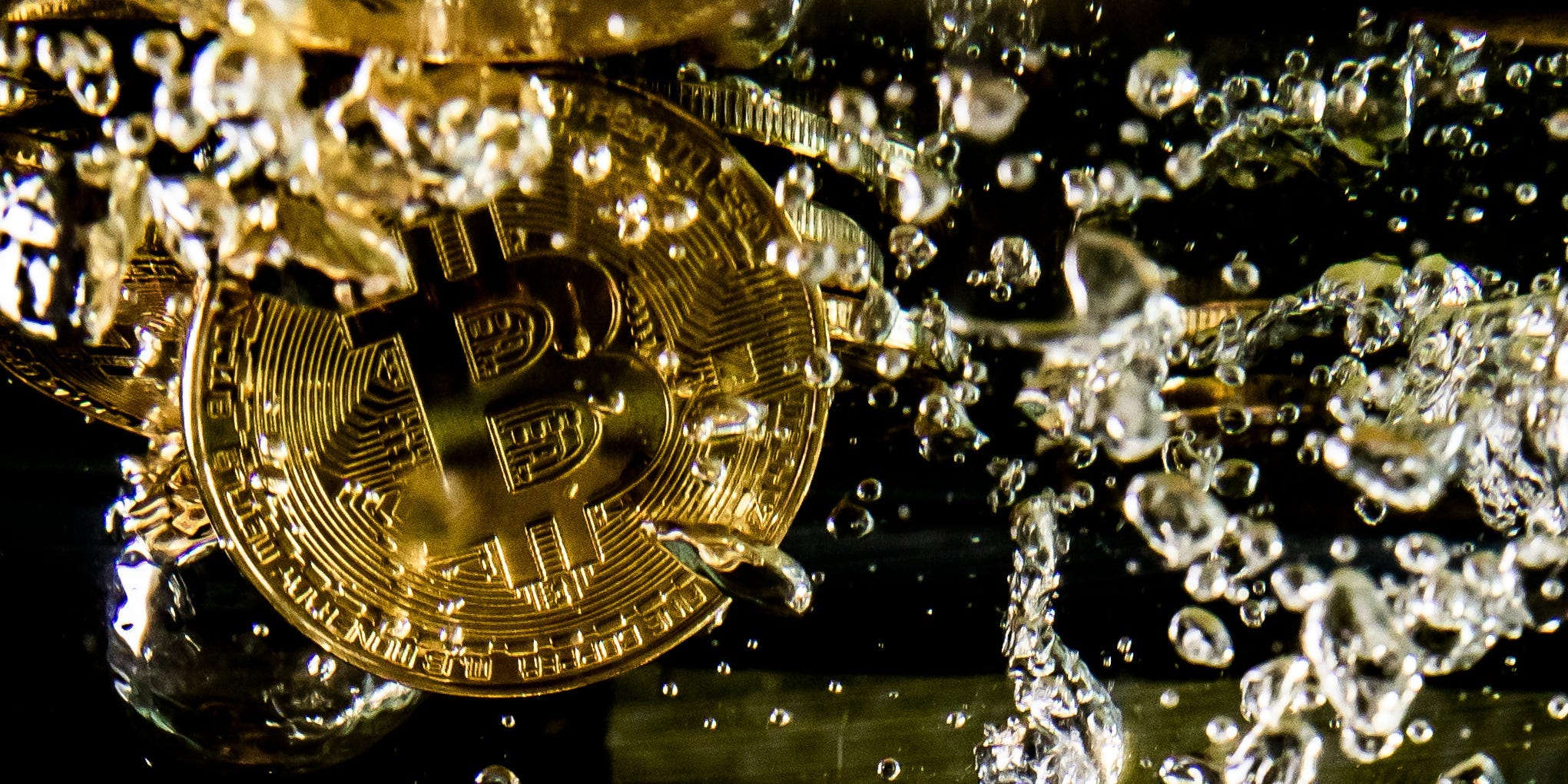 In this photo illustration a visual representation of the digital currency Bitcoin sinks into water on August 15, 2018 in London, England.