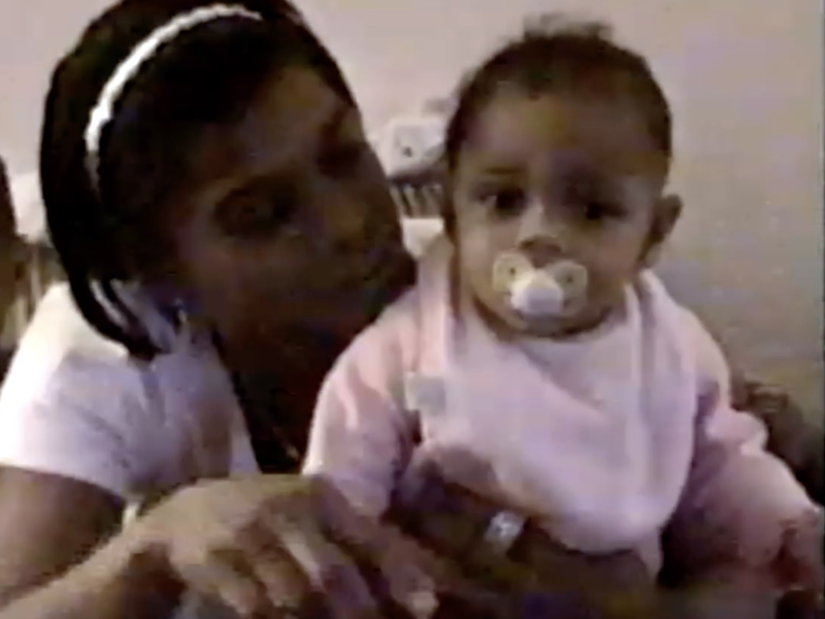 Simone Biles and her biological mother from a home video.