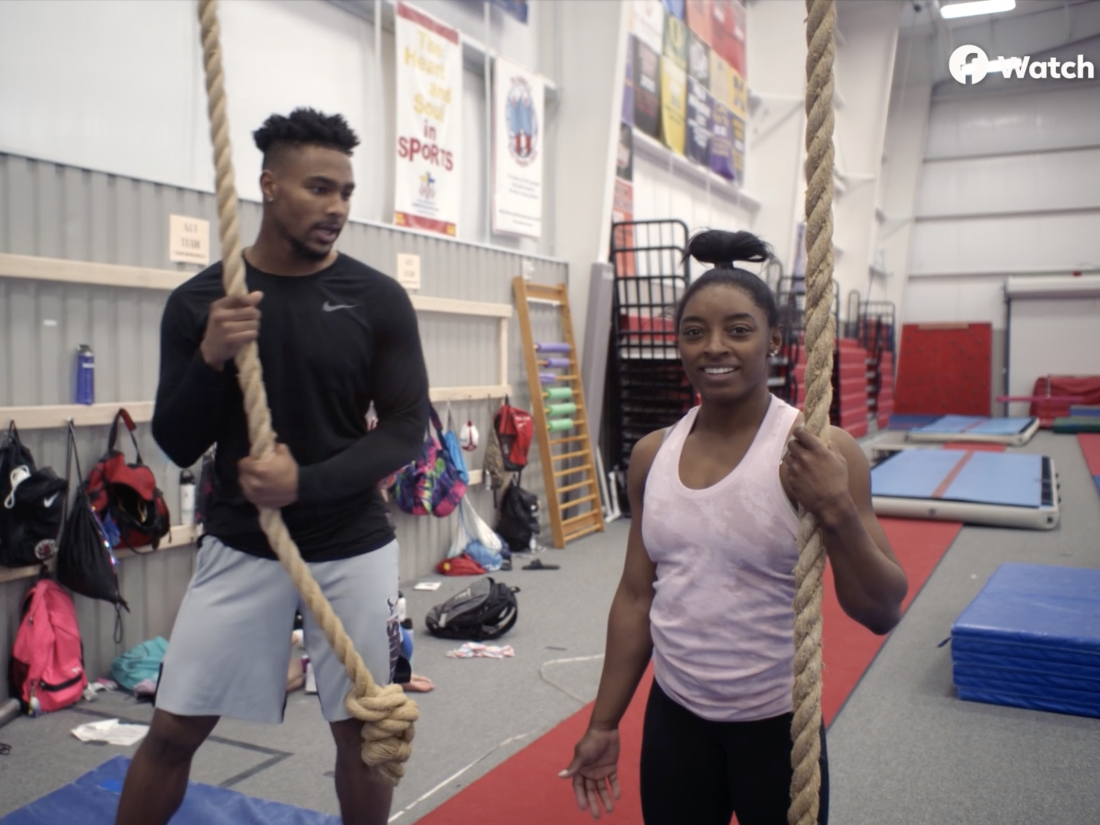 Simone Biles (right) and Jonathan Owens at the gym.