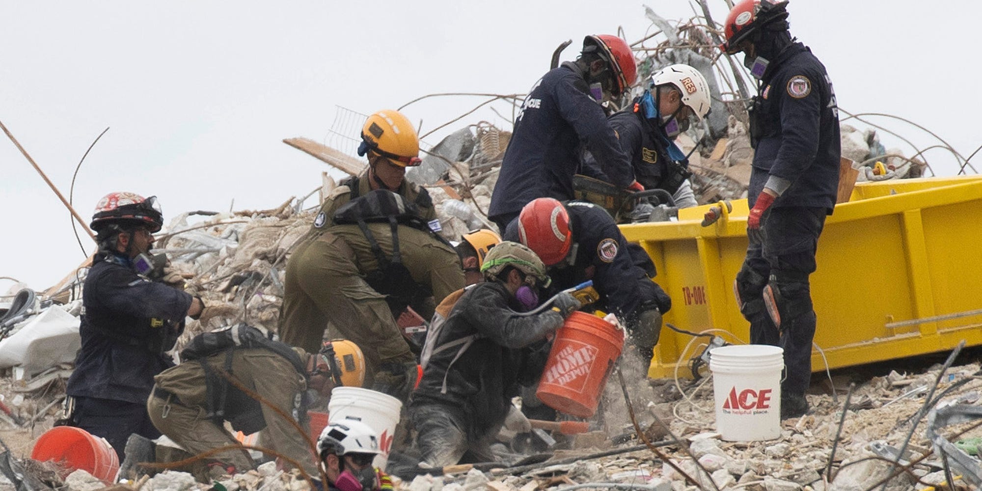 Search and Rescue teams look for possible survivors and to recover remains in the partially collapsed 12-story Champlain Towers South condo building on June 29, 2021 in Surfside, Florida.