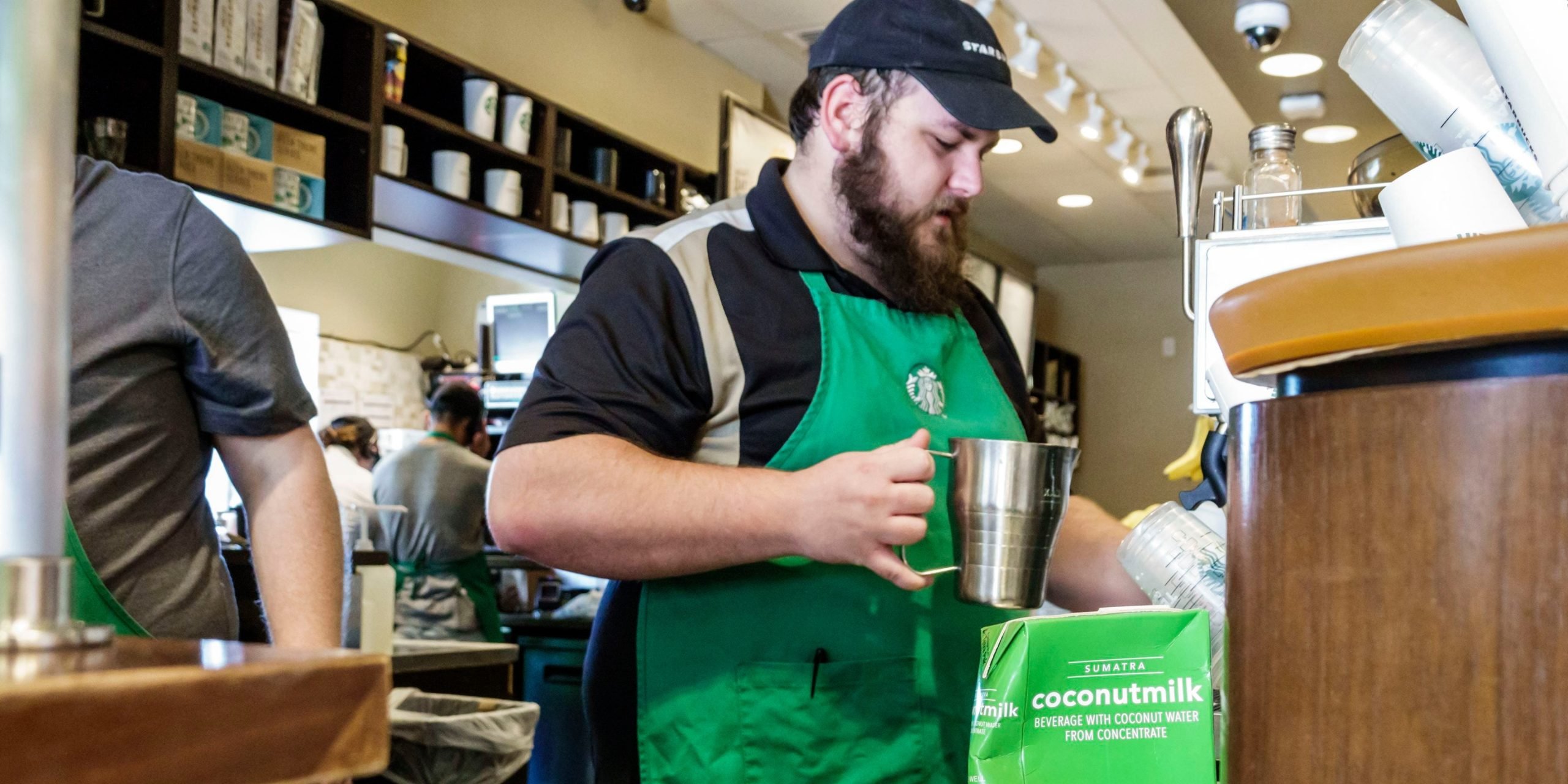 A Starbucks barista makes coffee in Florida.