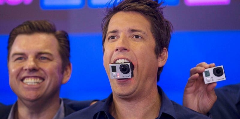 GoPro Inc's founder and CEO Nick Woodman holds a GoPro camera in his mouth as he celebrates GoPro Inc's IPO at the Nasdaq Market Site in New York City, June 26, 2014.  REUTERS/Mike Segar   