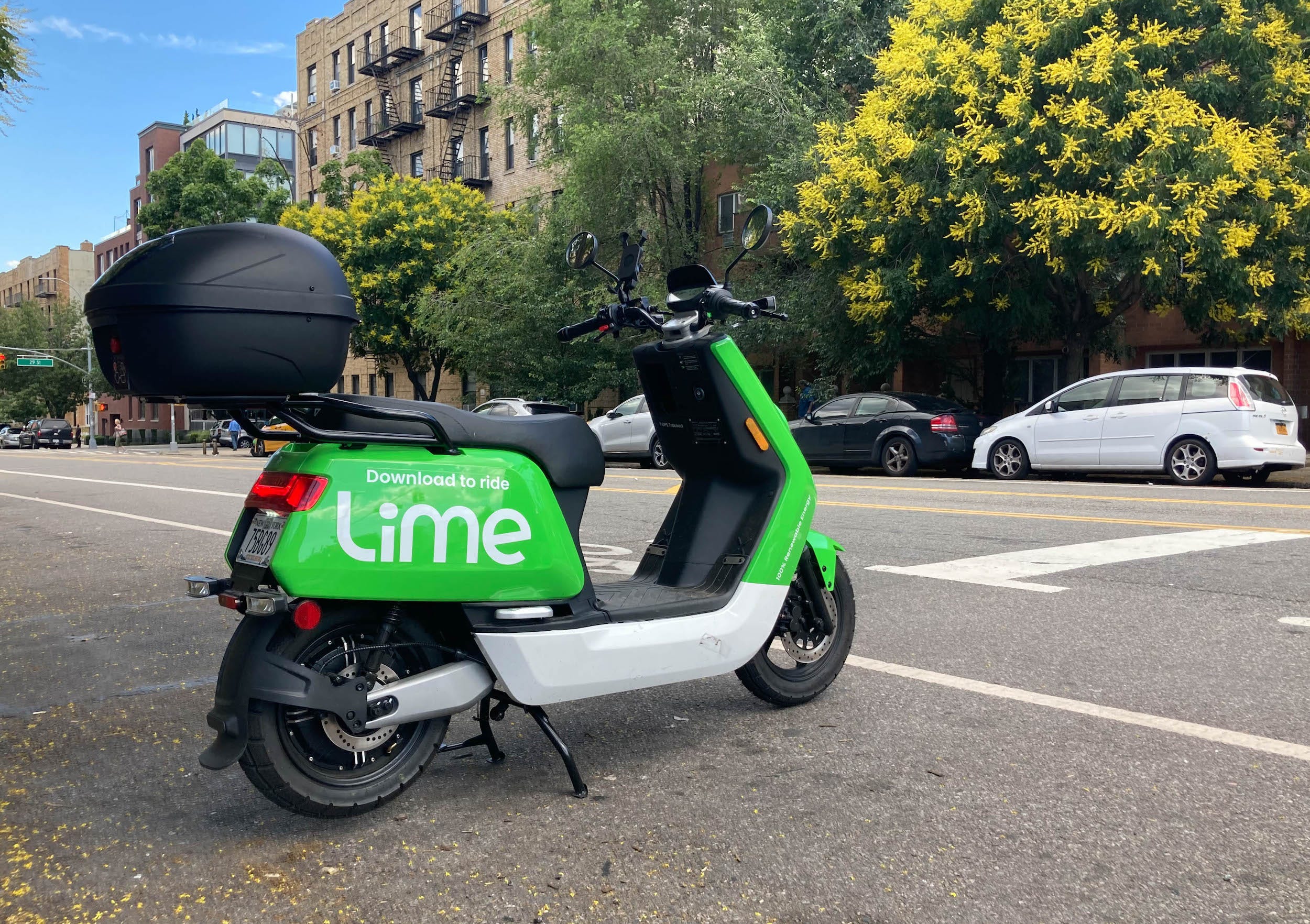 A bright green electric moped from the micromobility company Lime.