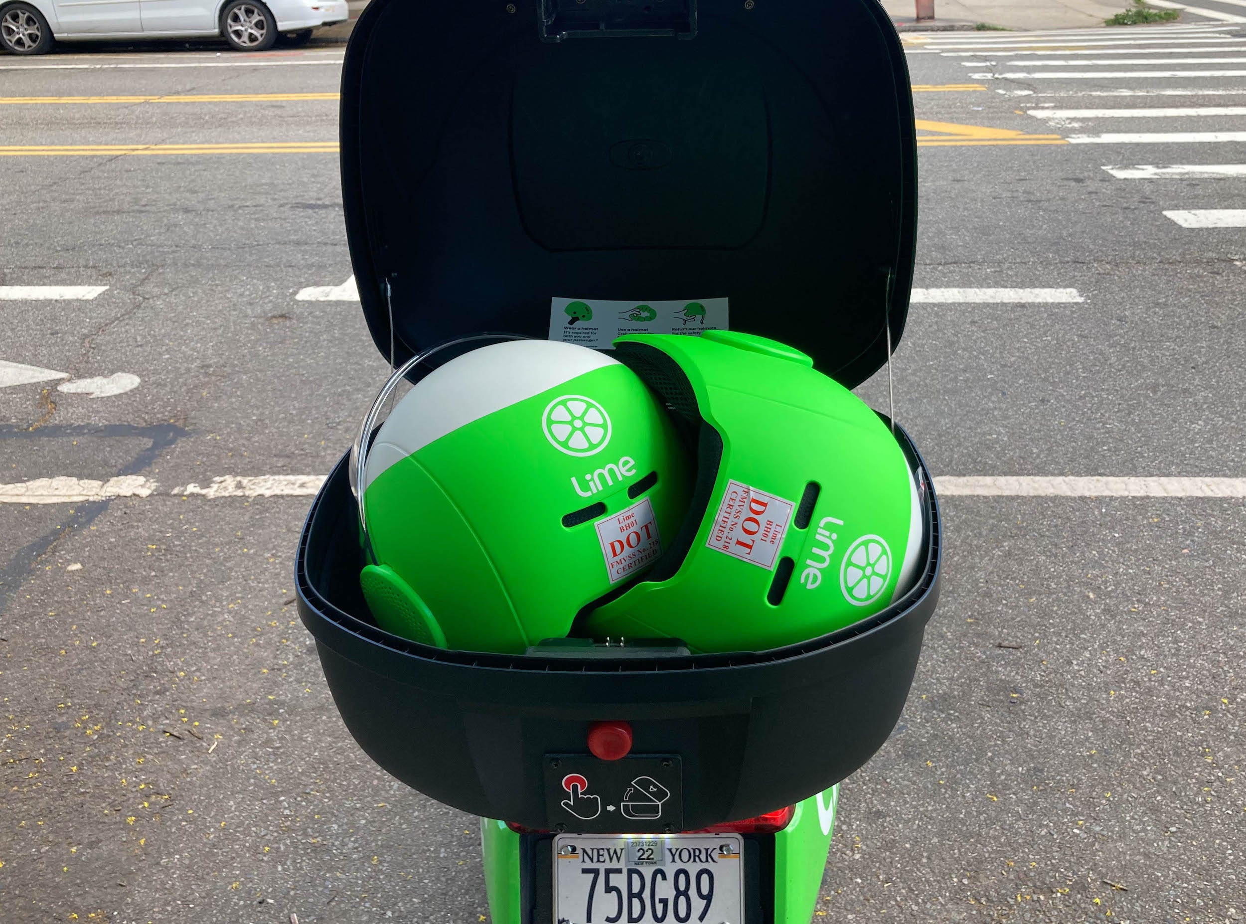 A bright green electric moped from the micromobility company Lime.