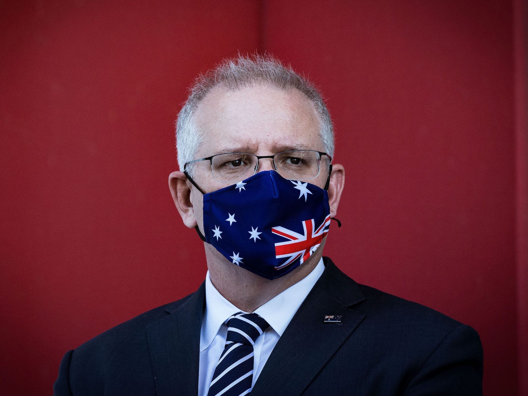 MELBOURNE, AUSTRALIA - NOVEMBER 16: Prime Minister Scott Morrison looks on during a press conference at CSL Lab where a COVID-19 Vaccine is being produced on November 16, 2020 in Melbourne, Australia. The federal government has announced a $1.8 billion agreement with pharmaceutical company CSL to construct a new biotech and vaccine manufacturing plant in Melbourne. The plant - to be the largest in the southern hemisphere - will deliver the first population-wide pandemic and seasonal flu vaccines for Australians, safeguarding the nation from global supply chain shortages or queues. (Photo by Darrian Traynor/Getty Images)