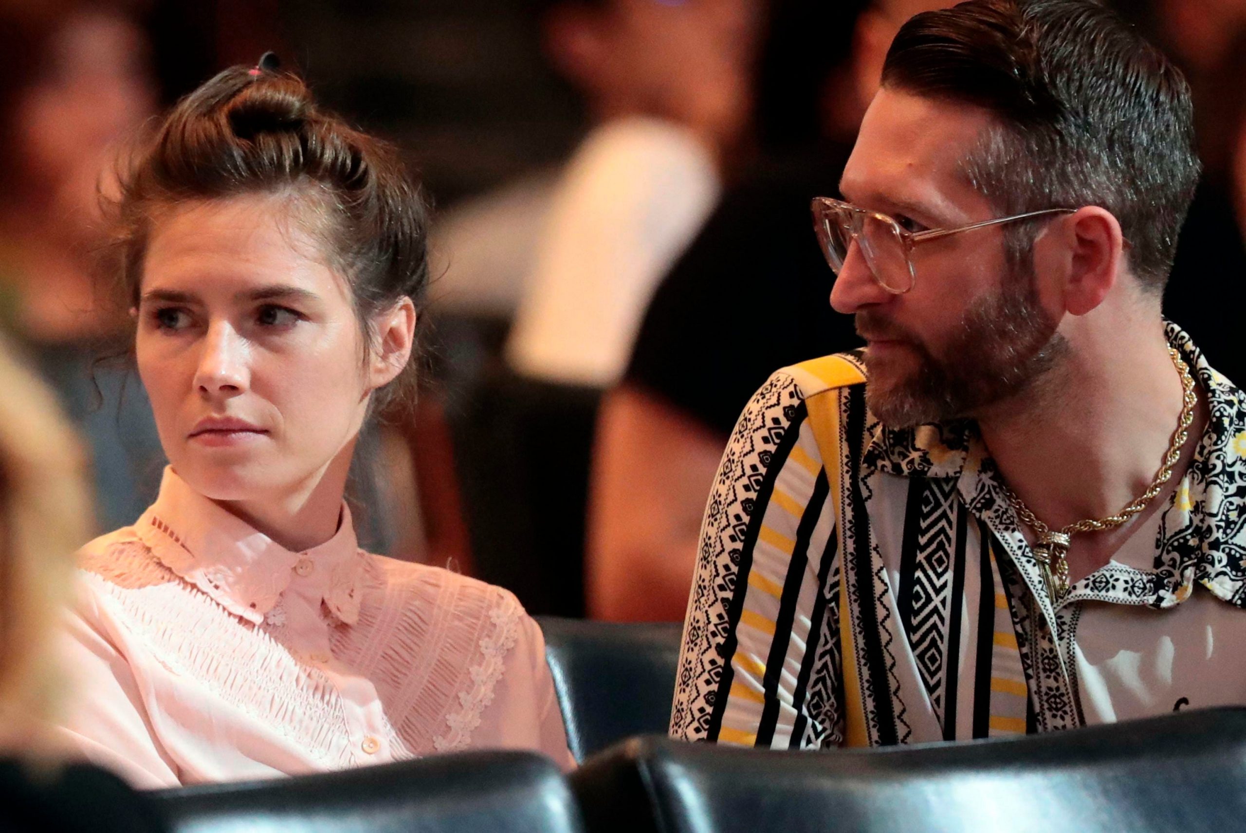 Amanda Knox and her fiancee Christopher Robinson attend a conference during a Criminal Justice Festival at the University of Modena, Italy, Friday, June, 2019. Knox, a former American exchange student who became the focus of a sensational murder case, arrived in Italy Thursday for the first time since an appeals court acquitted her in 2011 in the slaying of her British roommate. (Elisabetta Baracchi/ANSA via AP)