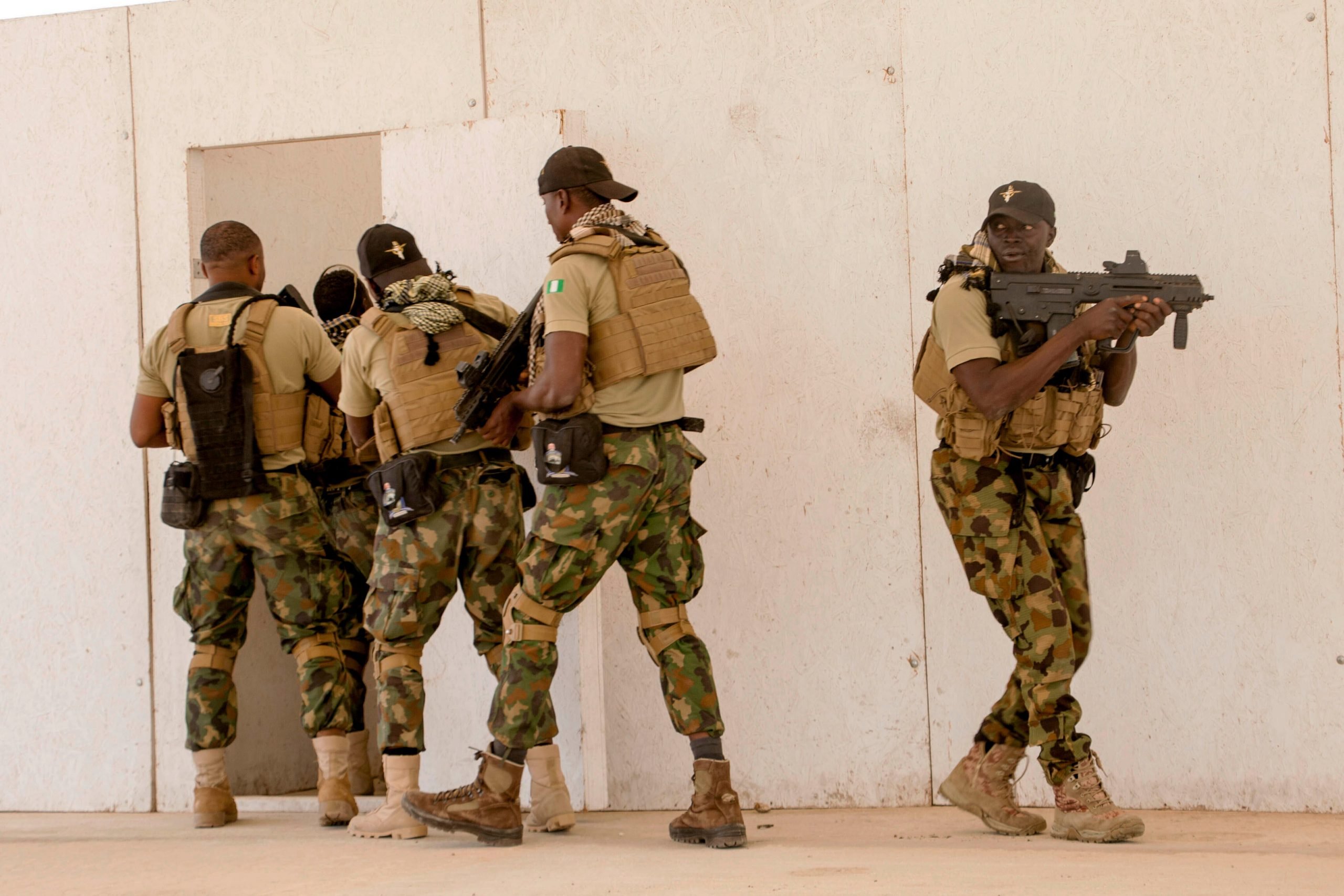 FILE - In this Feb. 18, 2020, file photo, Nigerian Navy Special Boat Service troops exercise under the supervision of British special forces during U.S. military-led annual counterterrorism exercise in Thies, Senegal. Both the Islamic State group and al-Qaida see the global upheaval caused by the new coronavirus as a threat but also as an opportunity to strike harder than before, asserting that the virus is punishment for non-Muslims while also urging followers to repent and take care of themselves. (AP Photo/Cheikh A.T. Sy, File)