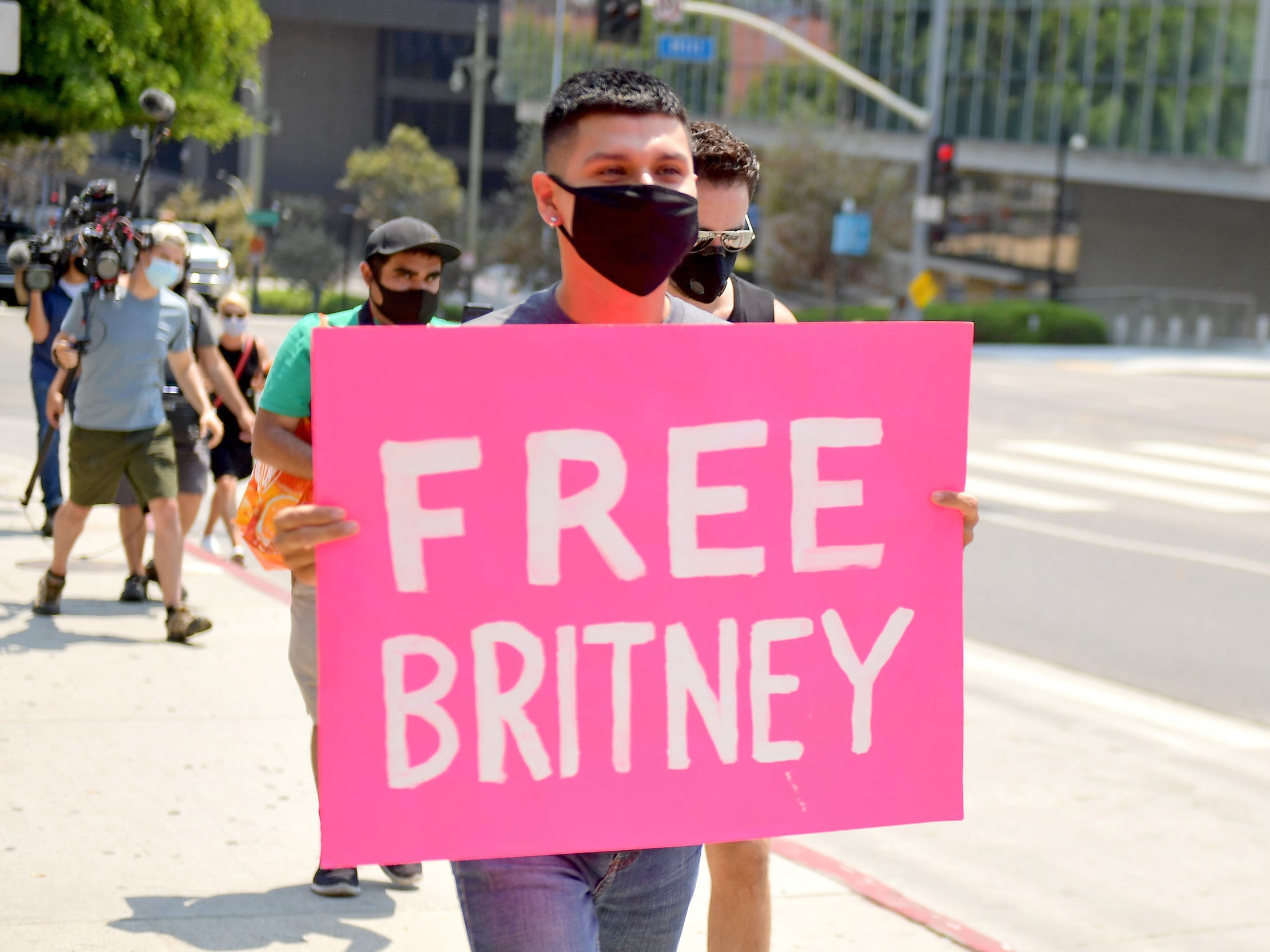 A person with a "Free Britney" sign.