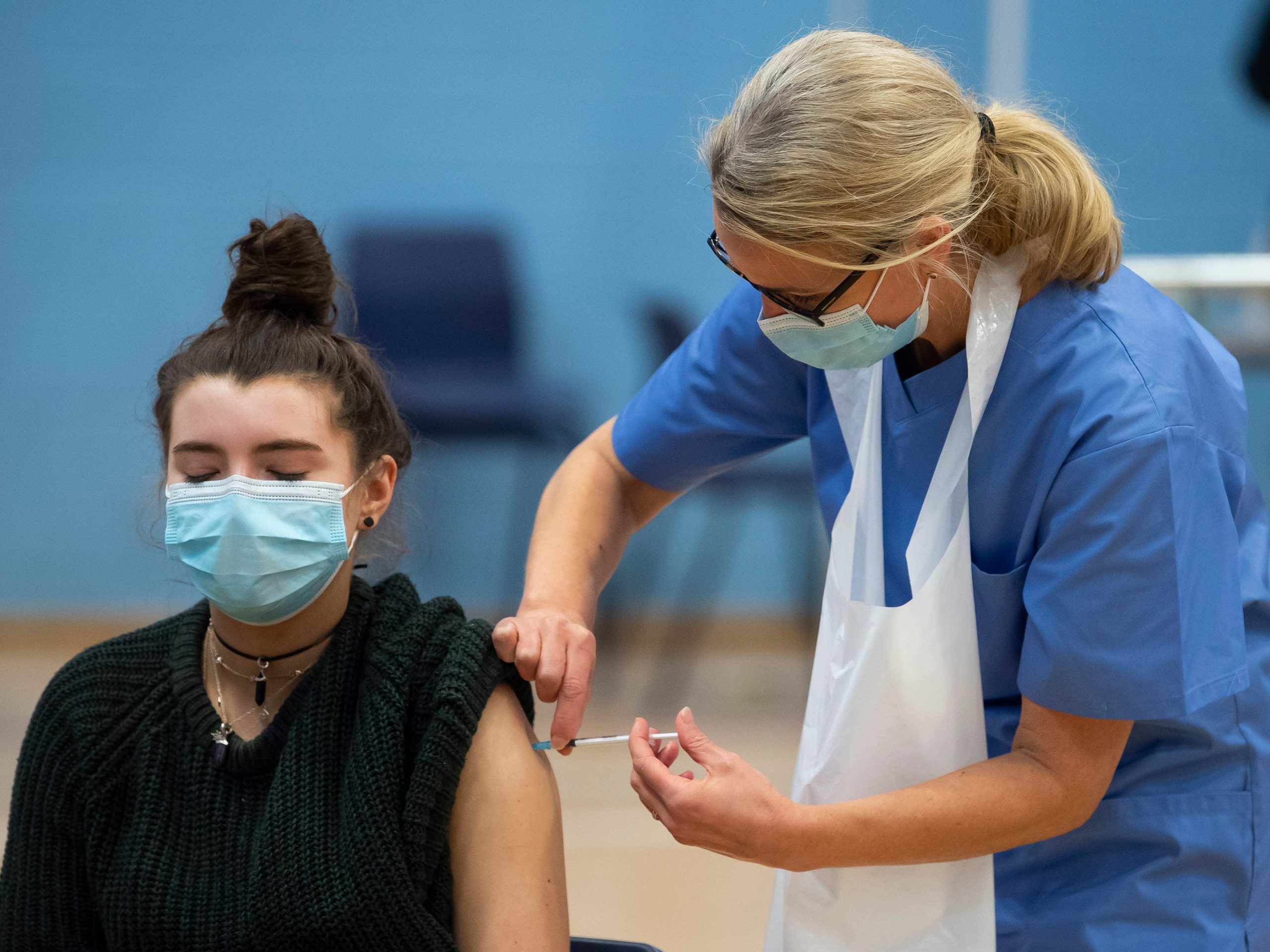 woman receiving covid vaccine