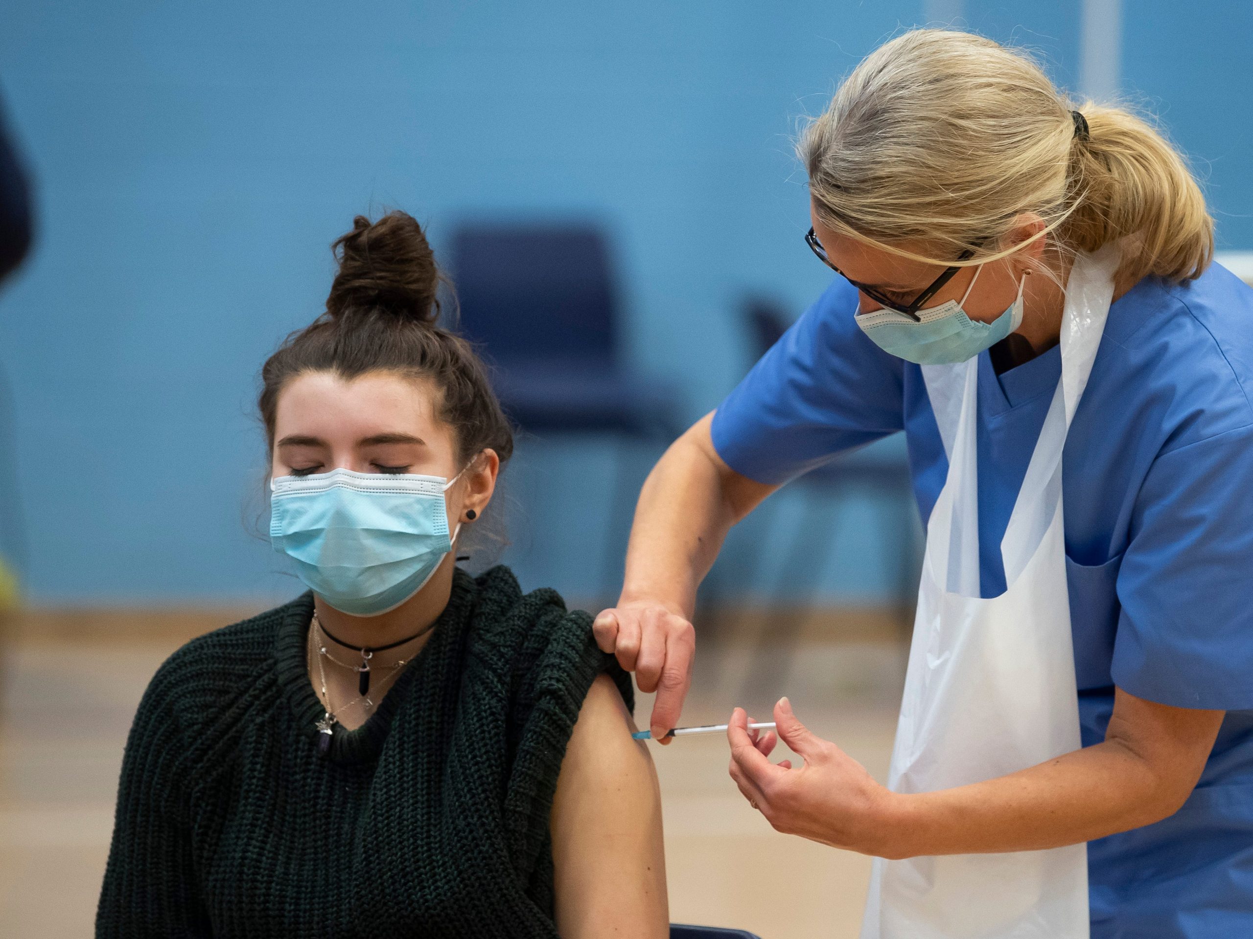 woman receiving covid vaccine