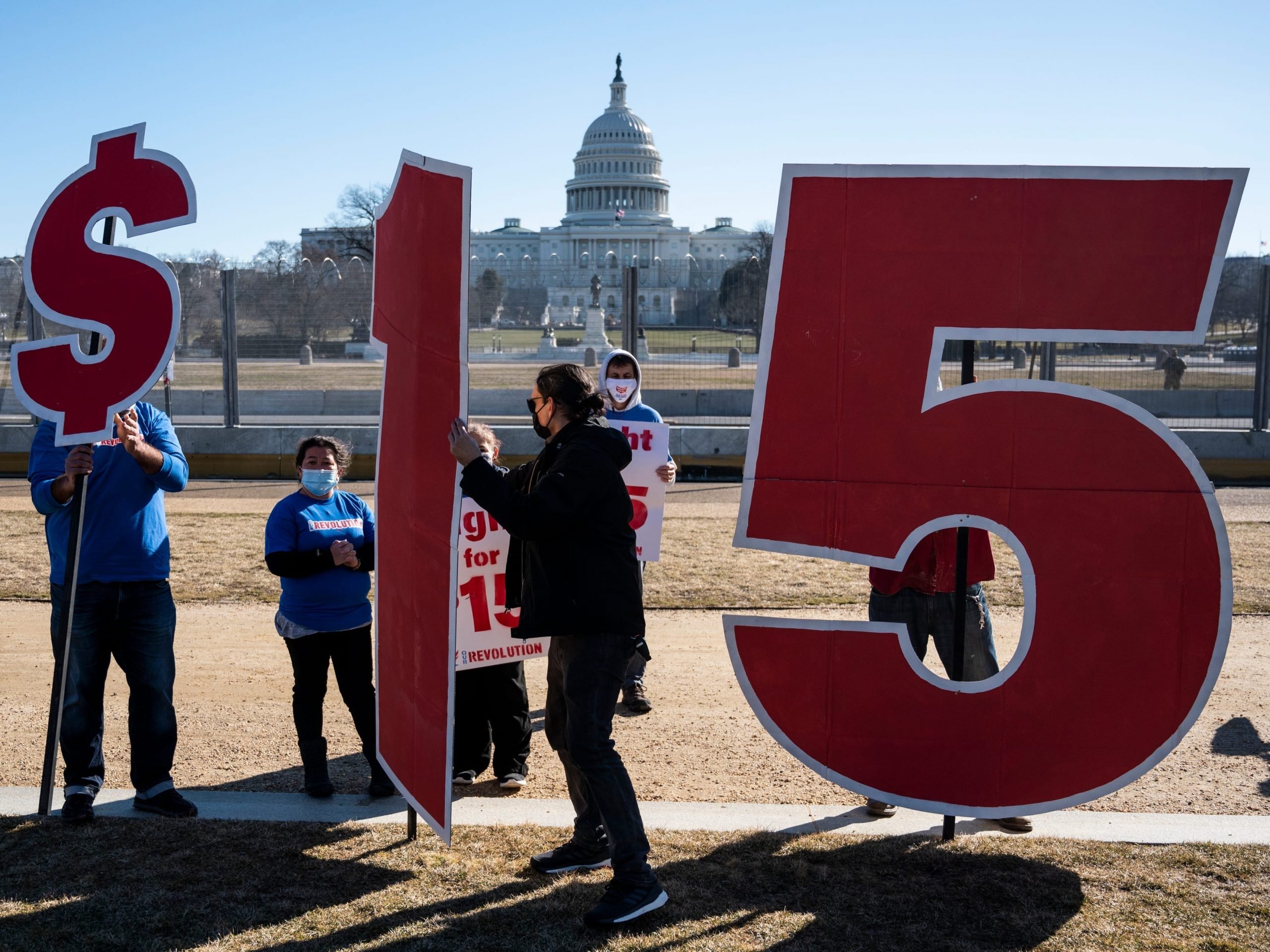 $15 minimum wage sign outside capitol