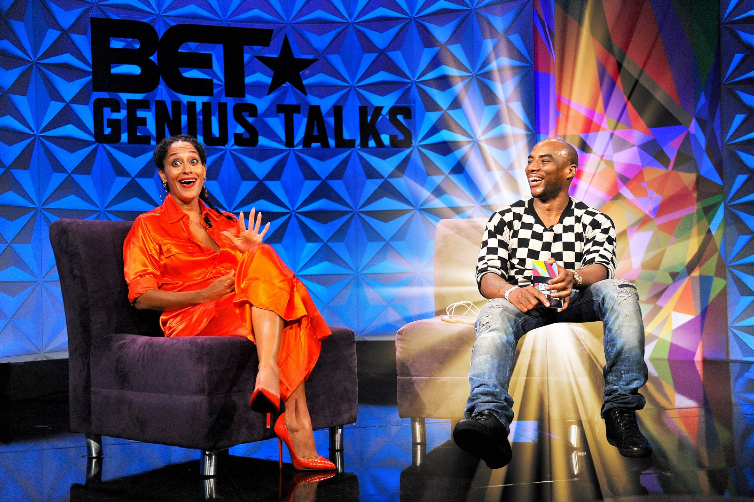 Charlamagne Tha God interviewing Tracee Ellis Ross with a golden light radiating from behind Charlamagne.