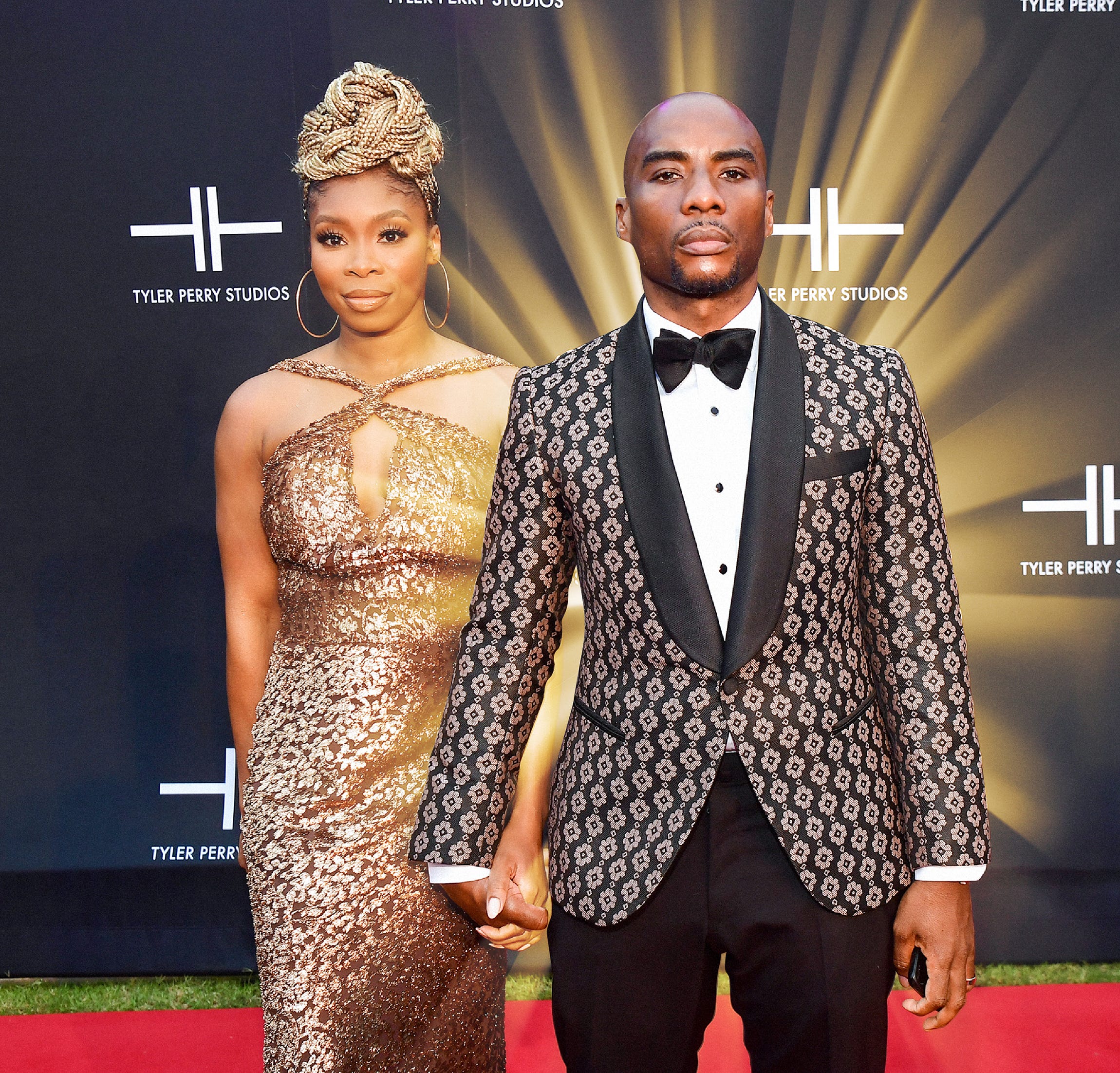 Charlamagne Tha God with a golden light radiating from behind him with his wife, Jessica Gadsden.