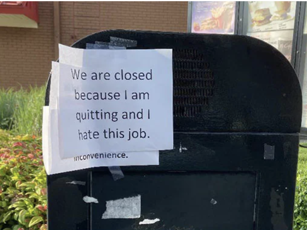 A sign at a McDonalds Drive-Thru explaining why a worker quit their job