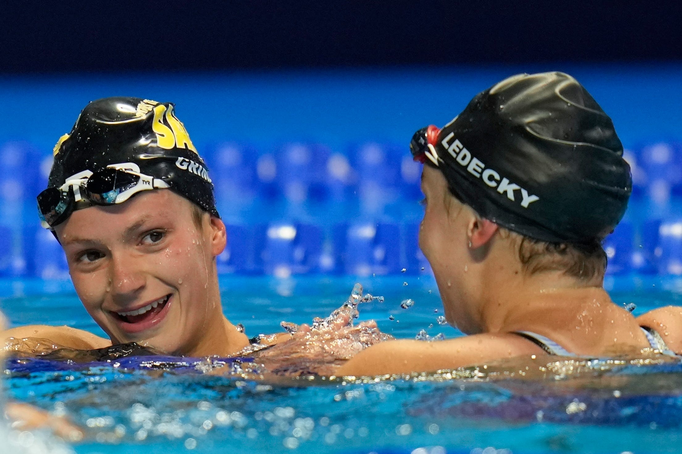 Katie Grimes (left) is congratulated by Katie Ledecky after their 800m freestyle race.