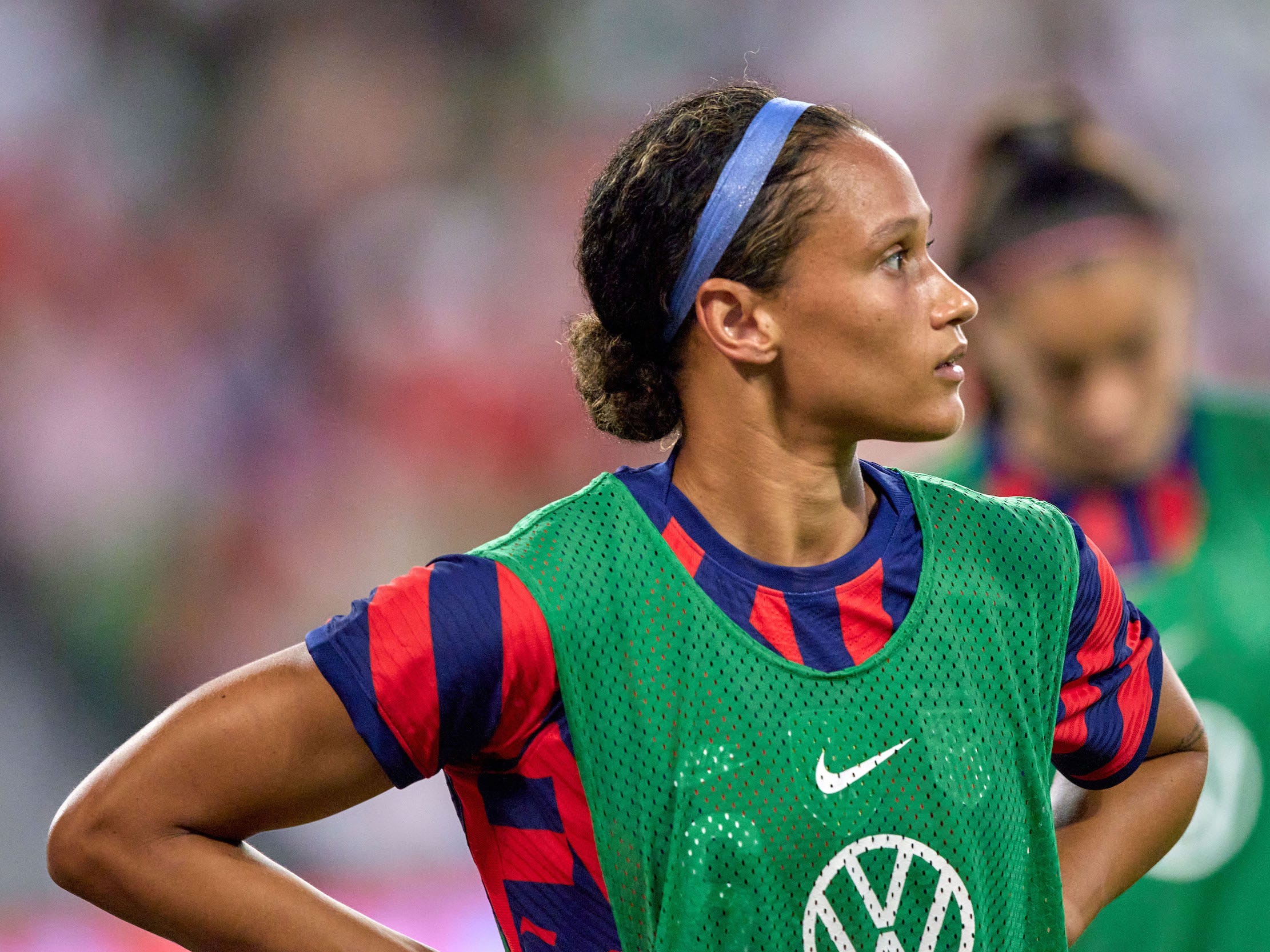 Lynn Williams waits for a USWNT substitution.