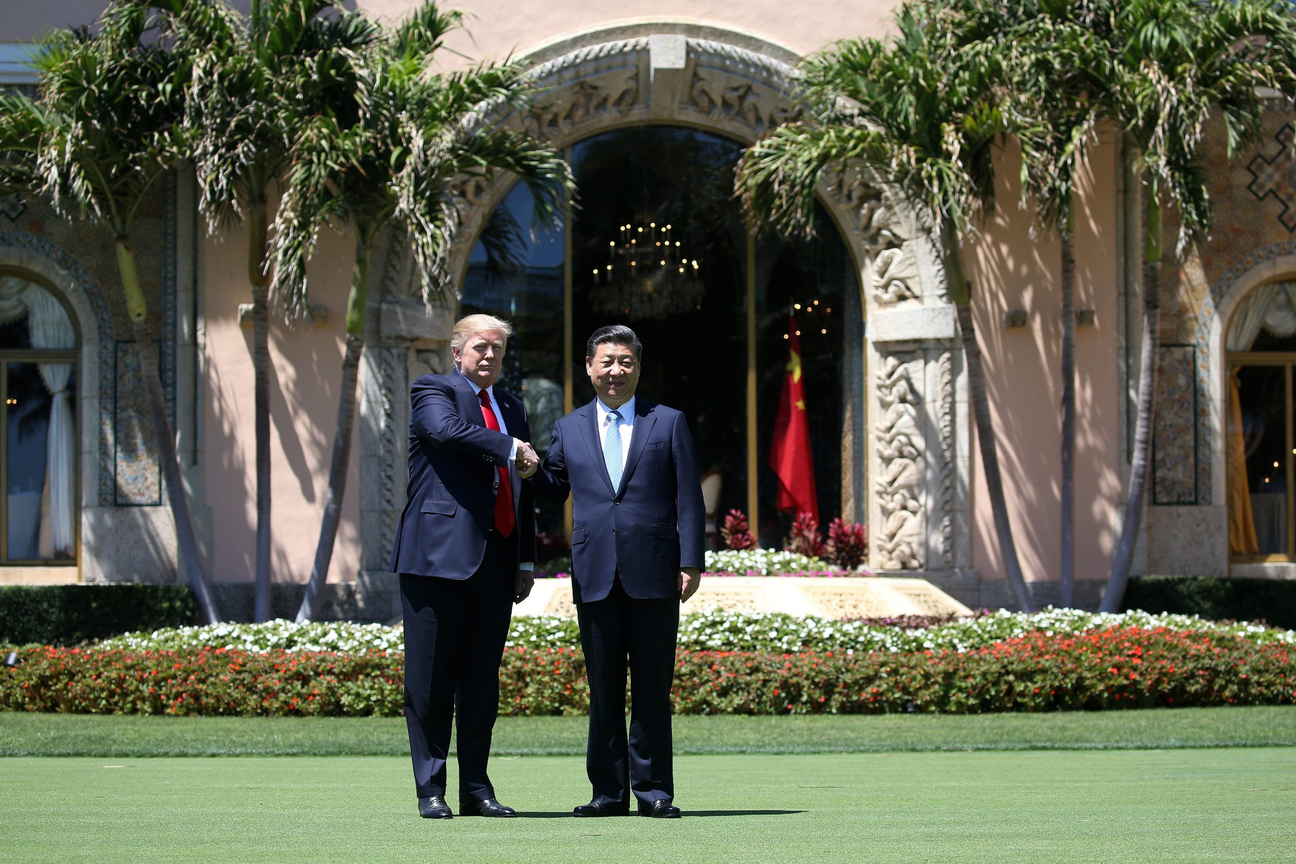 Trump shakes hands with China's President Xi Jinping outside Mar-a-Lago
