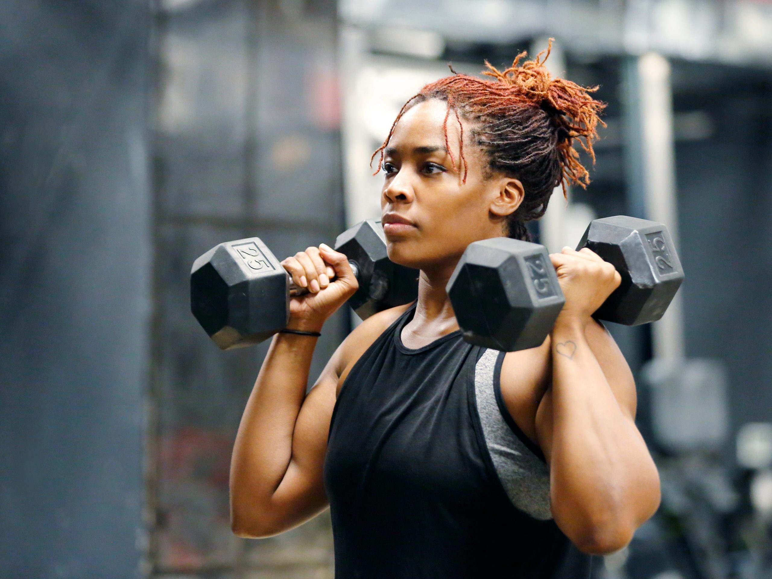 Woman lifting weights.