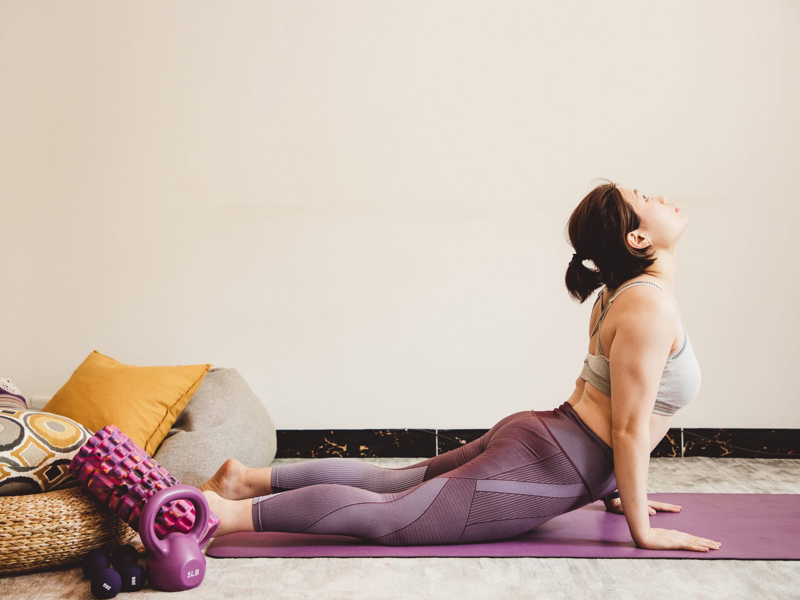 Woman doing cobra pose.