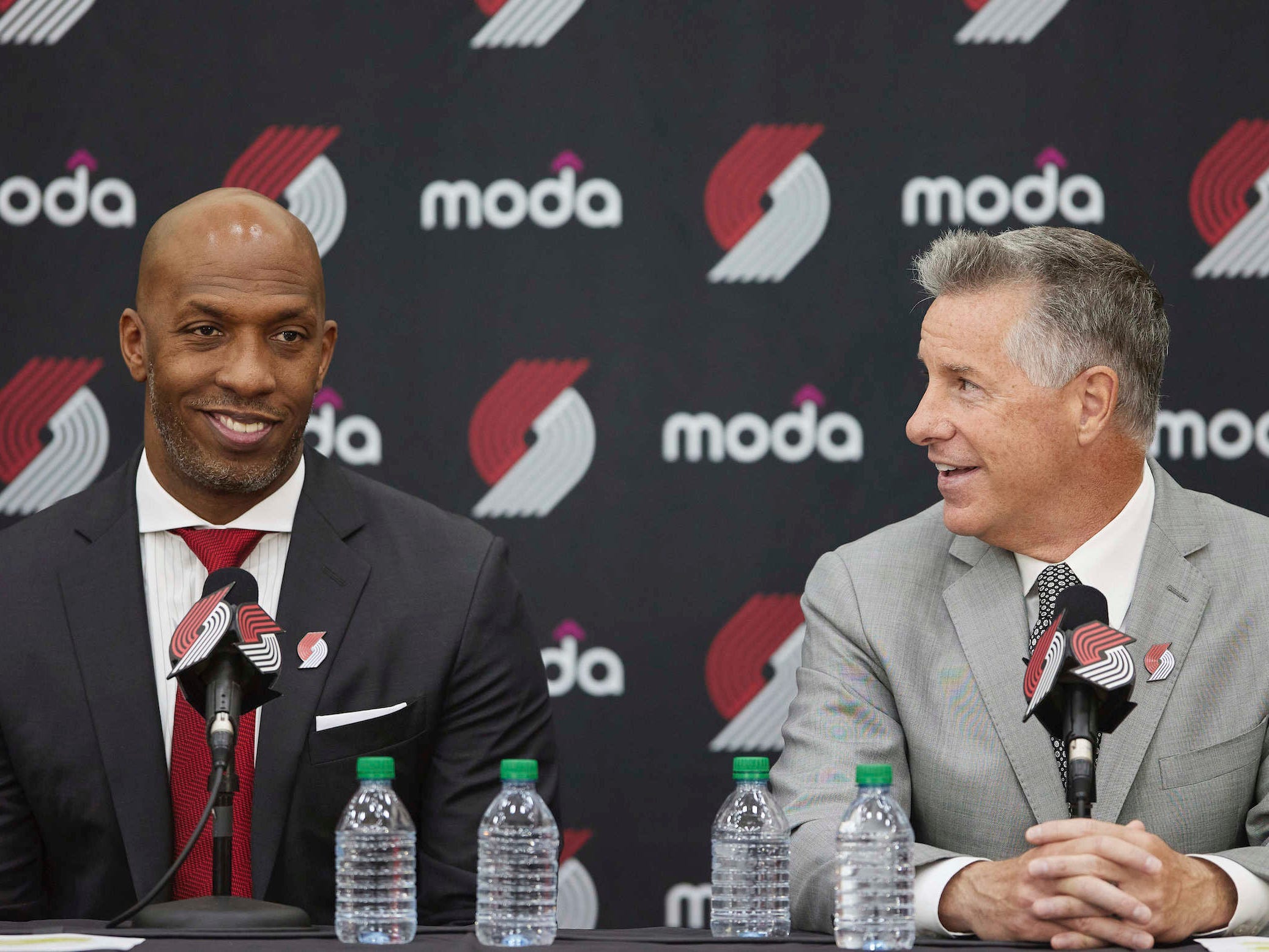 Chauncey Billups (left) and Neil Olshey speak at a press conference.