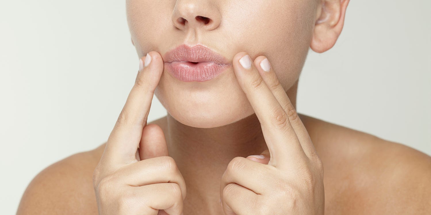 woman doing face yoga