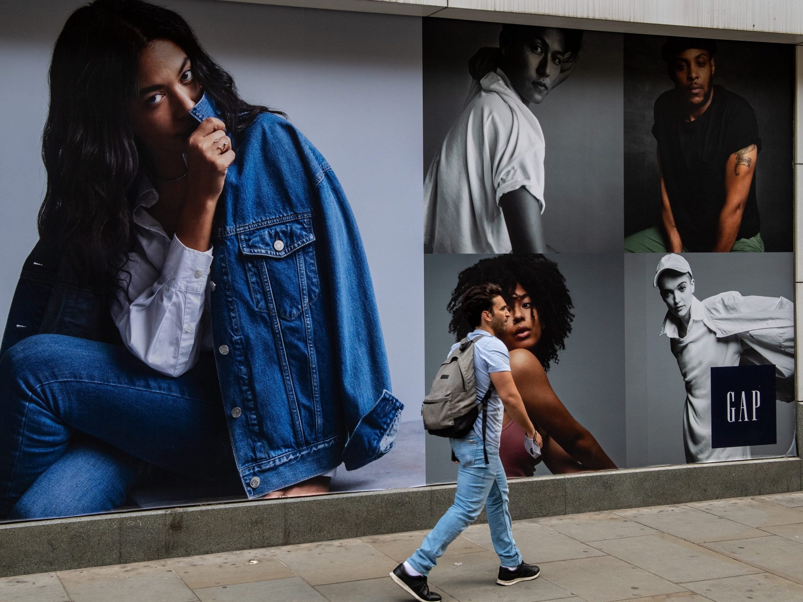 Shoppers pass the GAP store on Oxford Street on June 10, 2021 in London, England