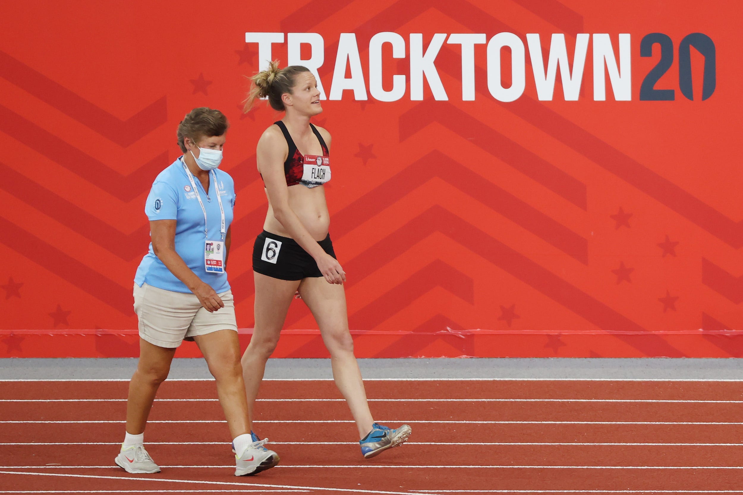 US heptathlete Lindsay Flach walks off the track after competing in the Olympic trials while 18 weeks pregnant.