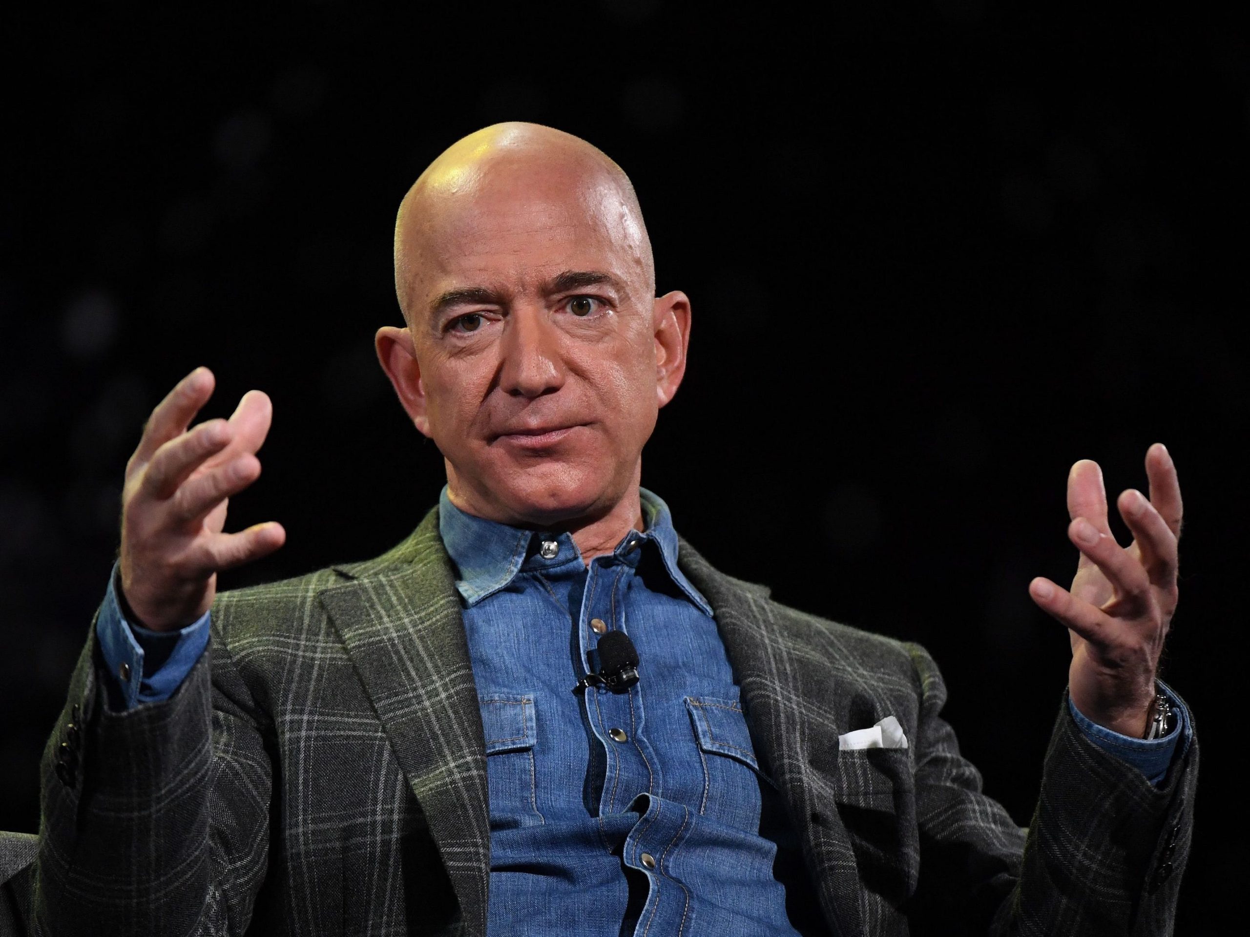 Amazon Founder and CEO Jeff Bezos addresses the audience during a keynote session at the Amazon Re:MARS conference on robotics and artificial intelligence at the Aria Hotel in Las Vegas, Nevada on June 6, 2019.