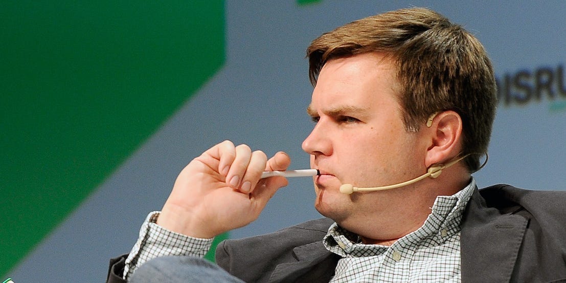 J.D. Vance holds a pen to his mouth onstage during Day 2 of TechCrunch Disrupt SF 2018 at Moscone Center on September 6, 2018 in San Francisco, California.