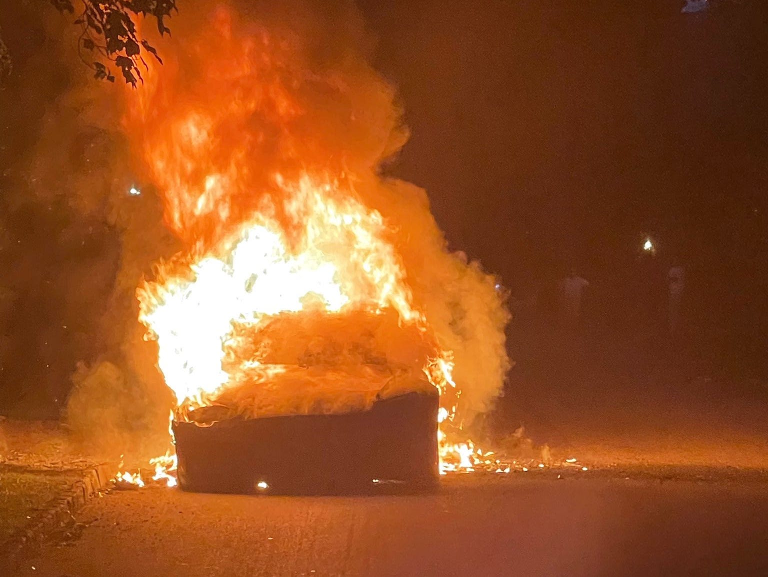 A Tesla Model S Plaid on fire