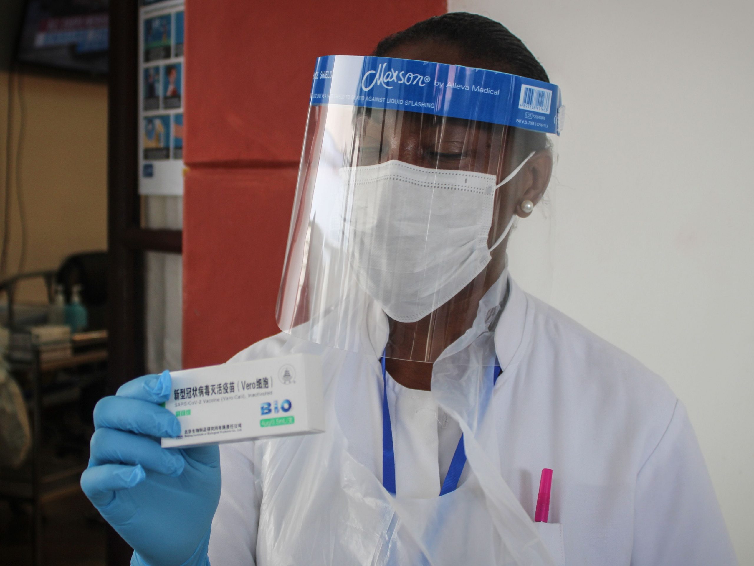 A medical personel holds a box of the first dose of the Chinese Covid-19 vaccine produced by Sinopharm at the Seychelles Hospital in Victoria, on January 10, 2021