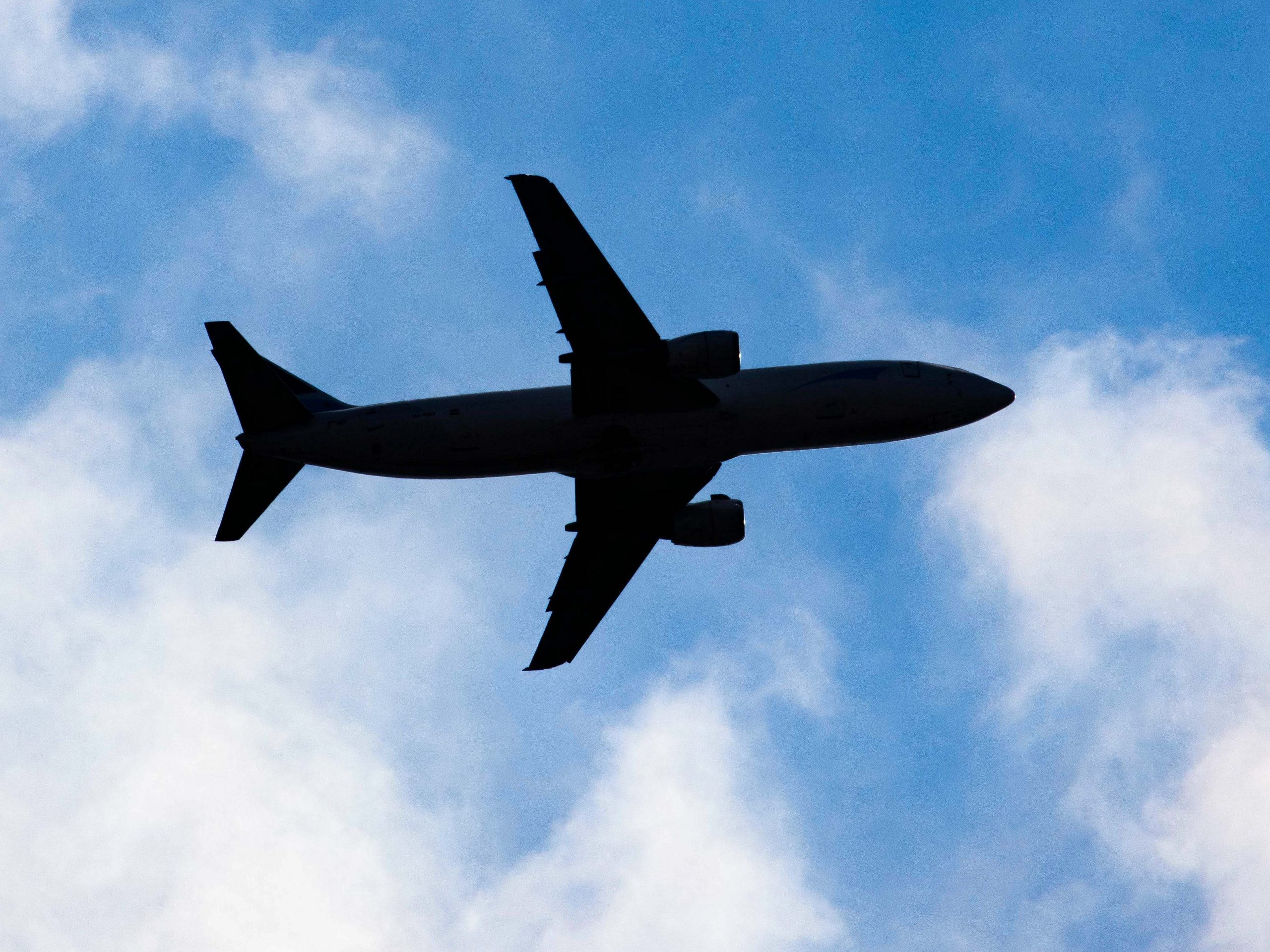 The silhouette of a Boeing 737 cargo jet